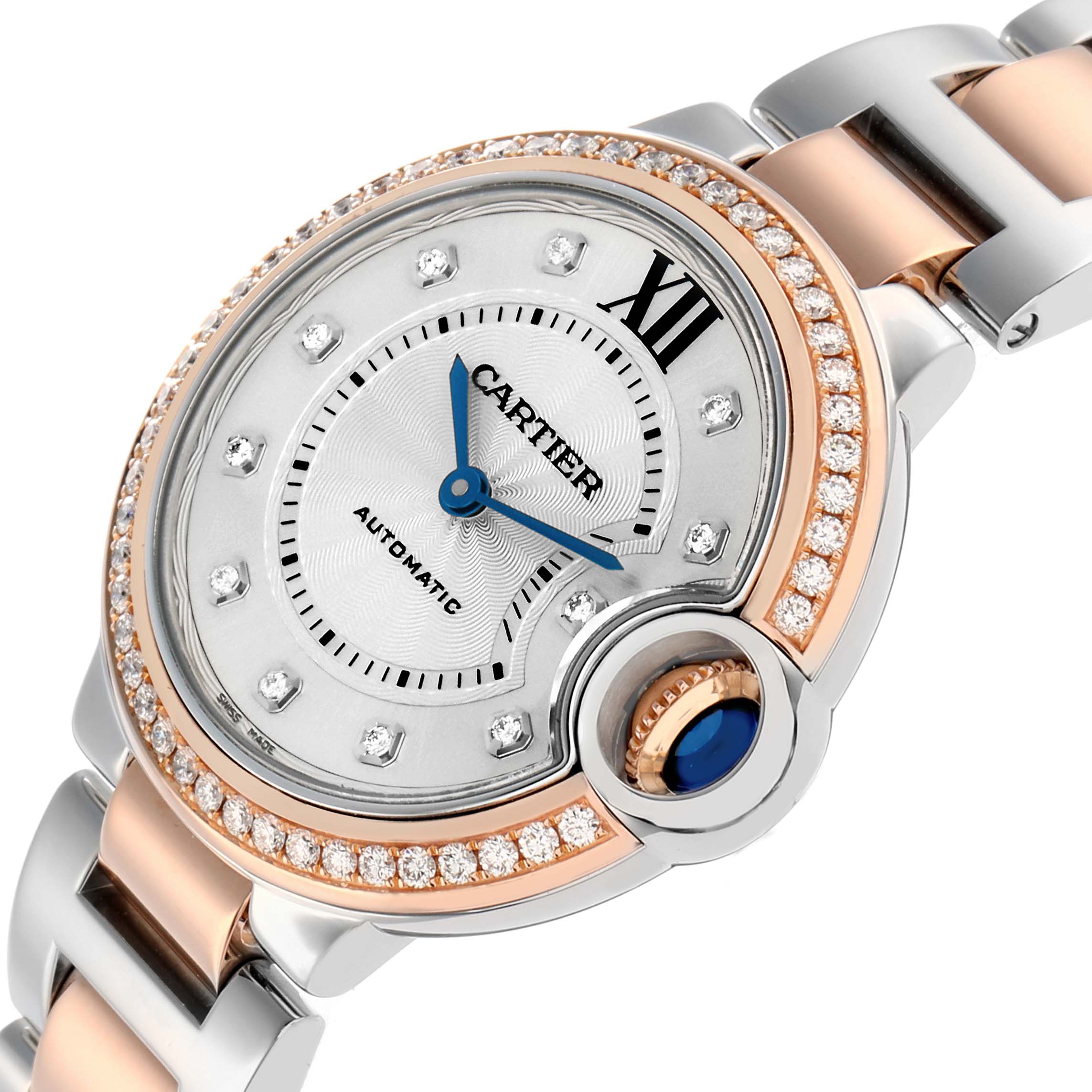 The image shows a Cartier Ballon Bleu WE902077 Women's Steel and Gold (two tone) Silver Dial watch at a three-quarter angle, highlighting the dial, bezel, and part of the bracelet.