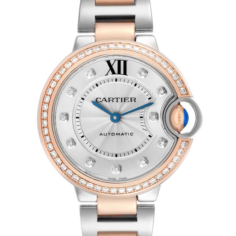 The Cartier Ballon Bleu WE902077 Women's Steel and Gold (two tone) Silver Dial watch is shown from a front angle, highlighting its face, bezel, and part of the bracelet.