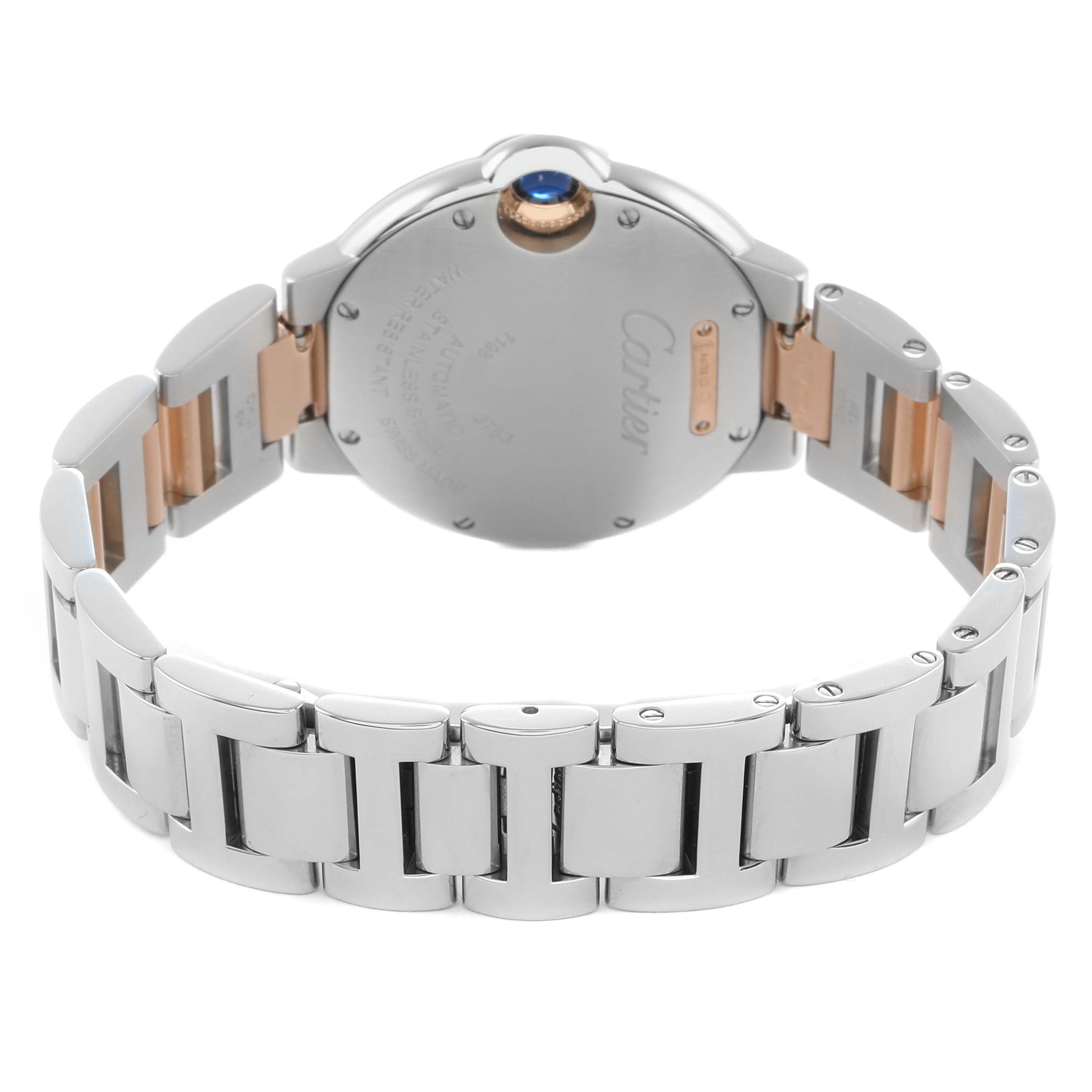 The image shows the back of a Cartier Ballon Bleu WE902077 Women's Steel and Gold (two tone) Silver Dial watch, highlighting the metal bracelet and closed case back with a blue cabochon.