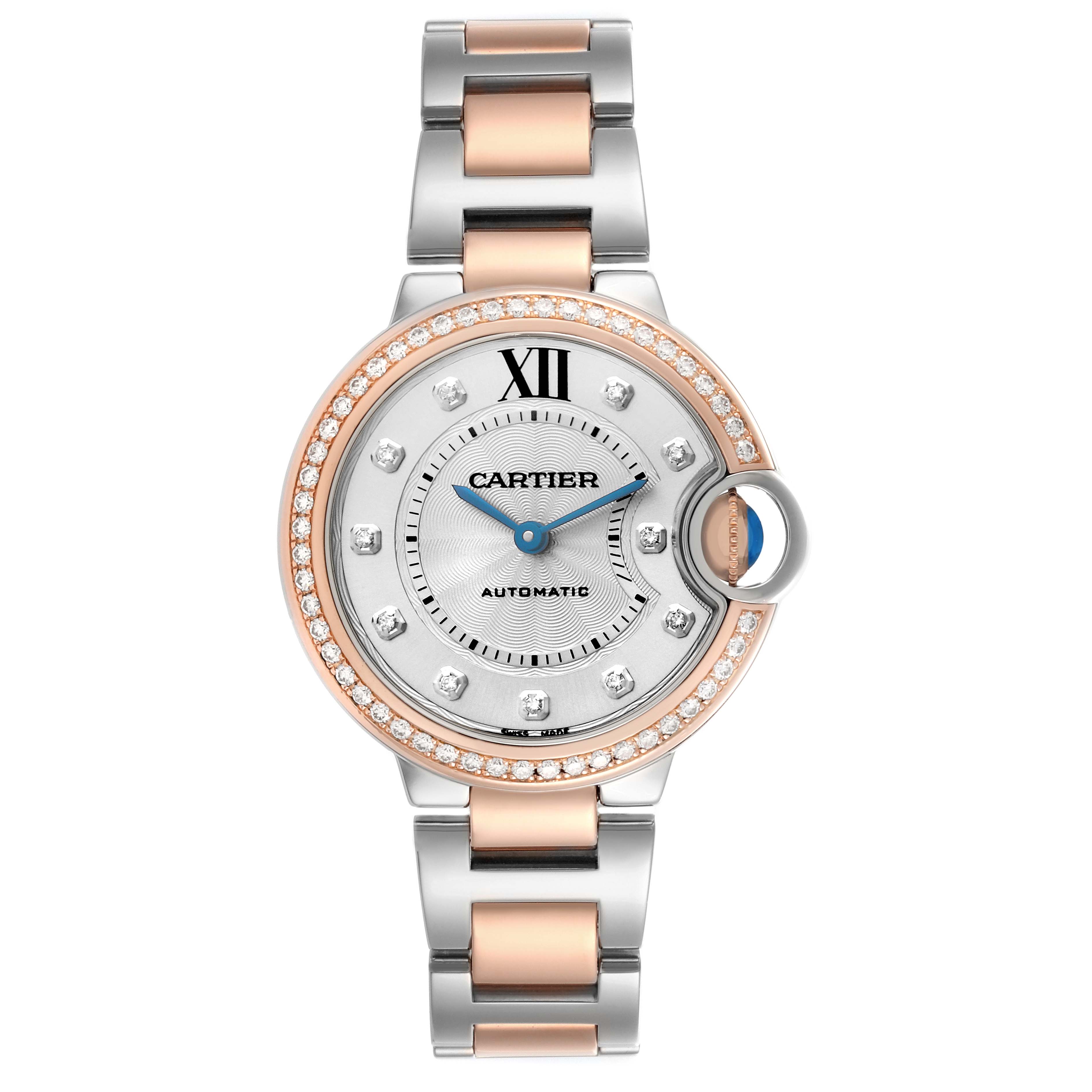 The Cartier Ballon Bleu WE902077 Women's Steel and Gold (two tone) Silver Dial watch is shown from a top-down angle, featuring a round dial, diamond bezel, and two-tone bracelet.
