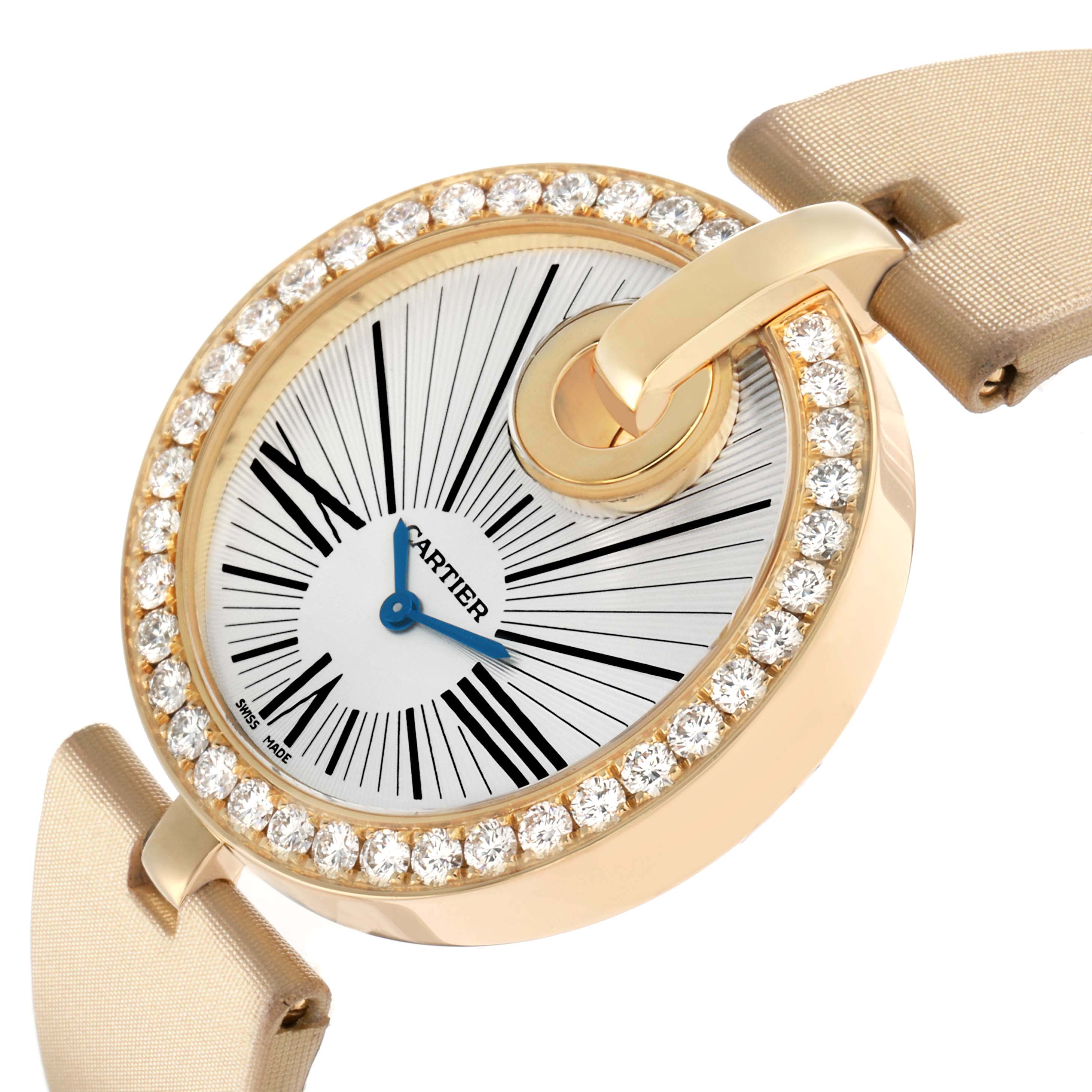 The Cartier Ballon Bleu WG600010 Women's Yellow Gold Silver Dial watch is shown at an angle highlighting the diamond-studded bezel, dial, and strap connections.