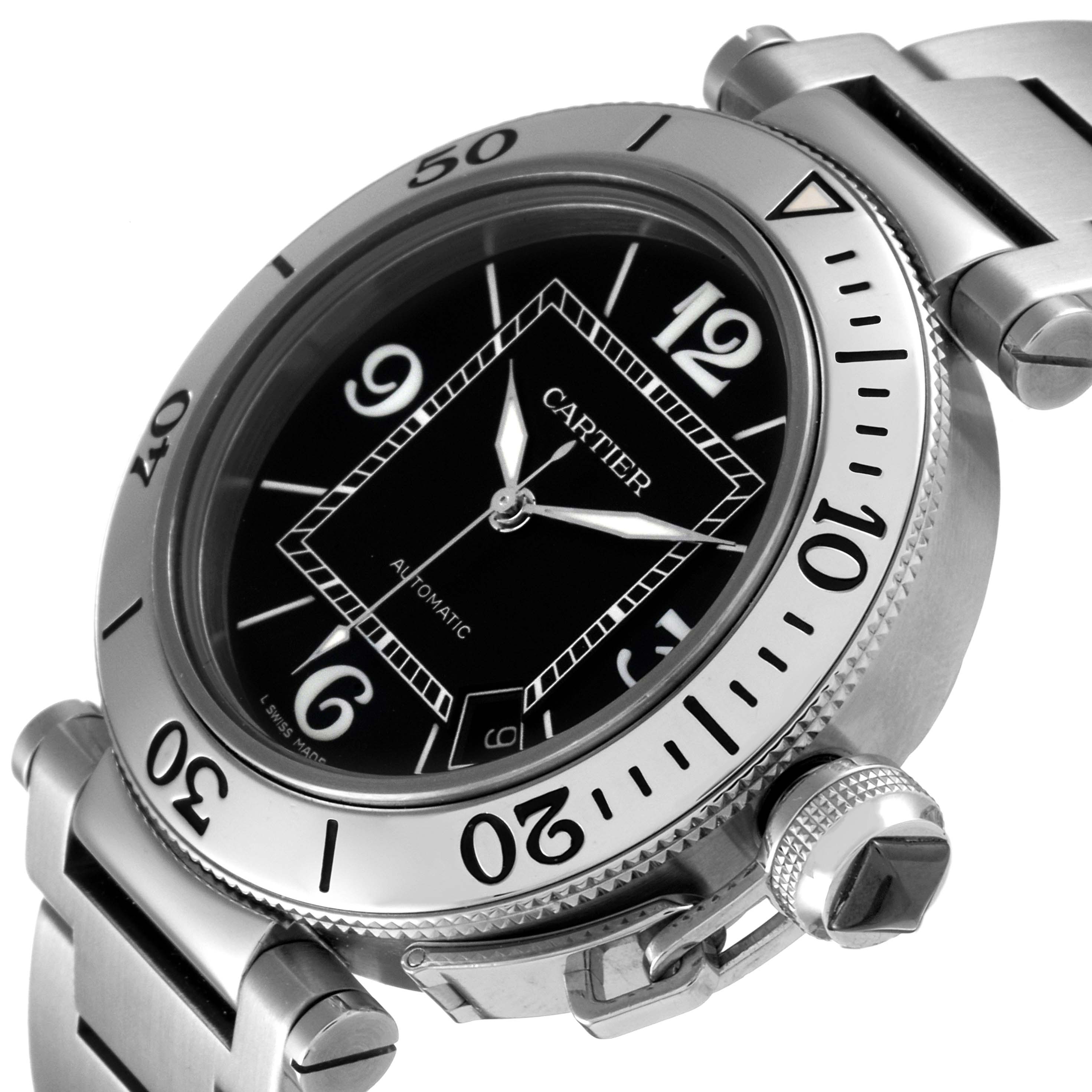 The image shows a close-up, angled view of the Cartier Pasha W31077M7 Men's Stainless Steel Black Dial W31077M7 Men's Stainless Steel Black Dial watch, highlighting the face, bezel, crown, and part of the bracelet.