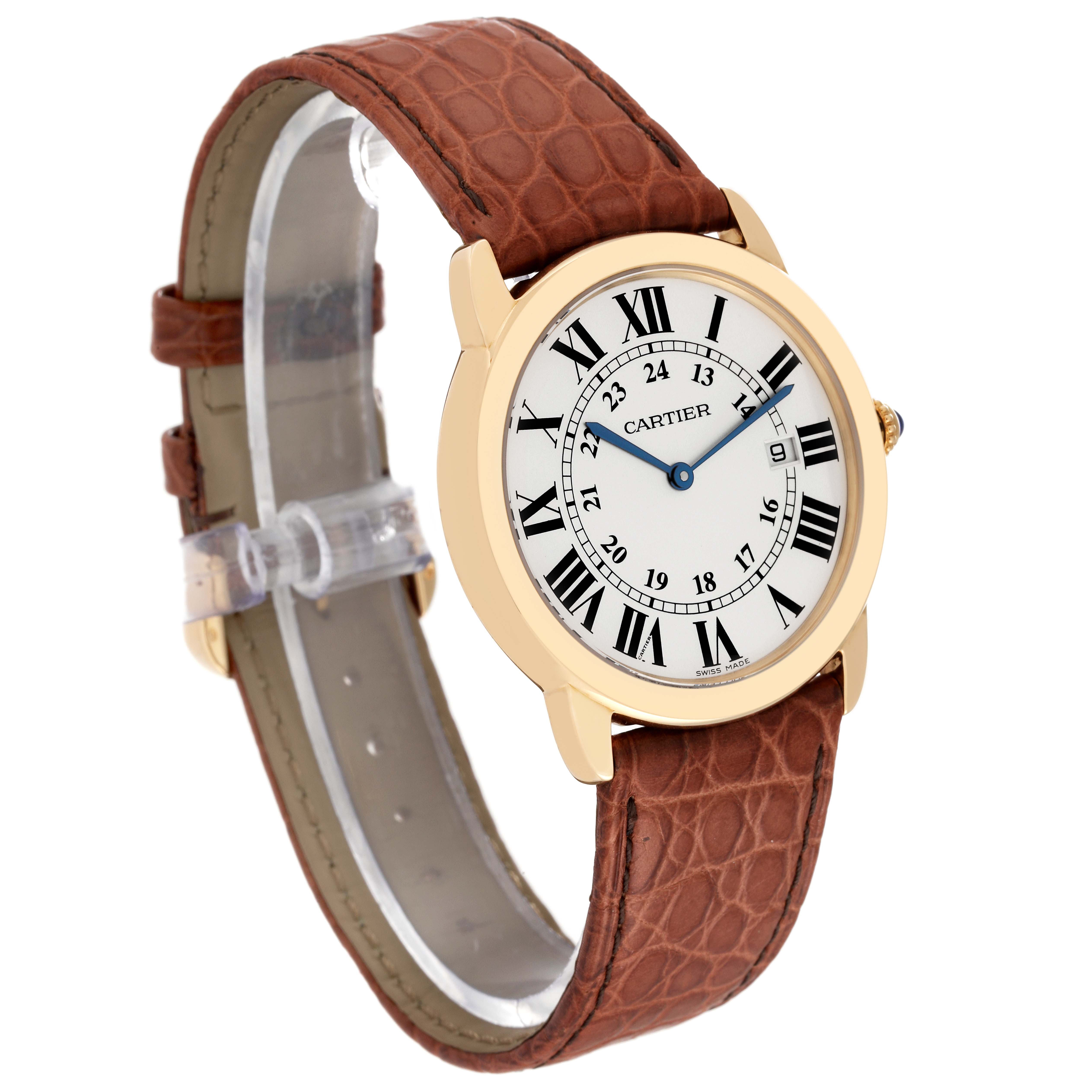 The Cartier Ronde W6700455 Men's Yellow Gold Silver Dial W6700455 Men's Yellow Gold Silver Dial watch is shown at an angle, displaying its face, bezel, and brown leather strap.