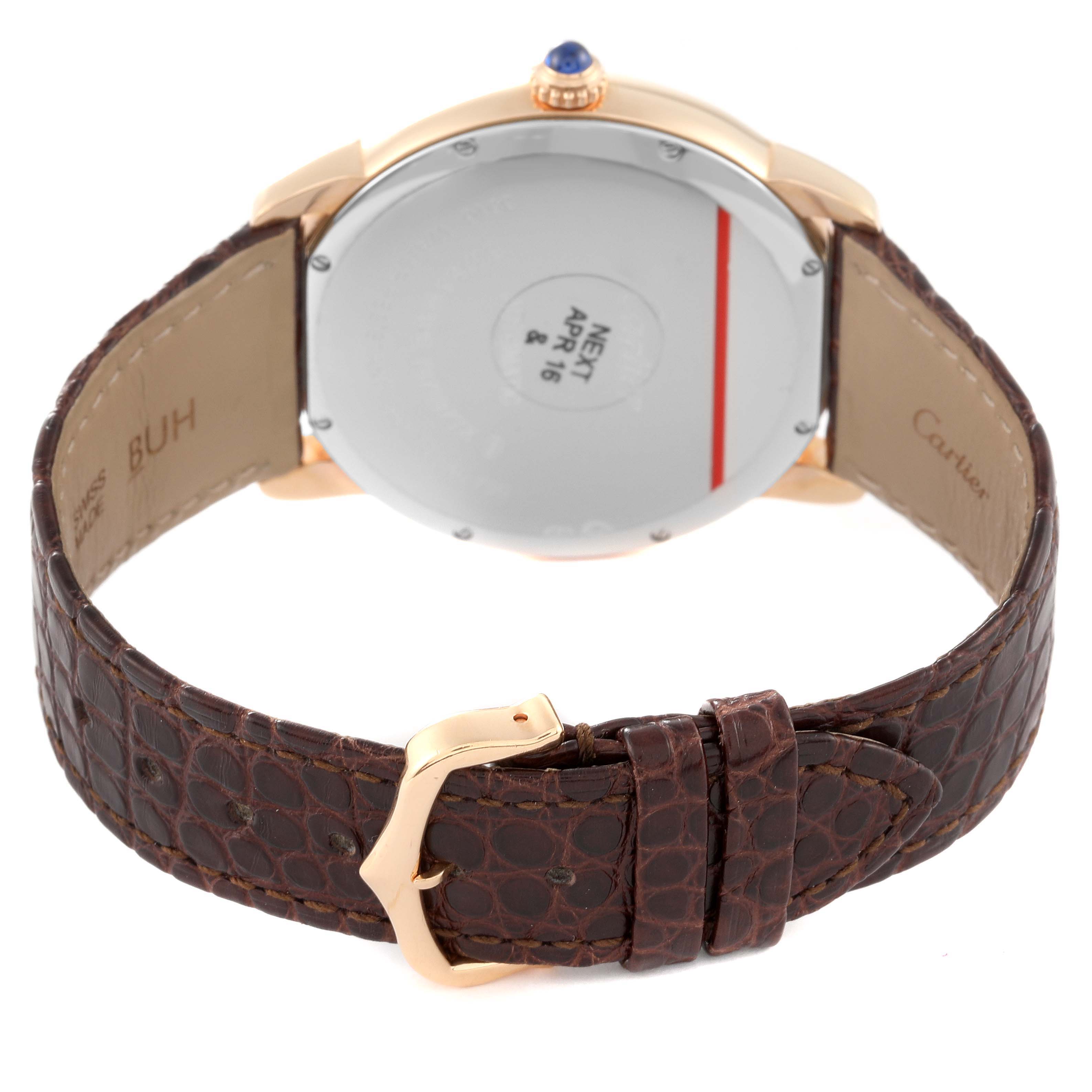 The Cartier Ronde W6701009 Men
s Yellow Gold Silver Dial W6701009 Men
s Yellow Gold Silver Dial watch is shown from the back angle, highlighting the case back, leather strap, and buckle.