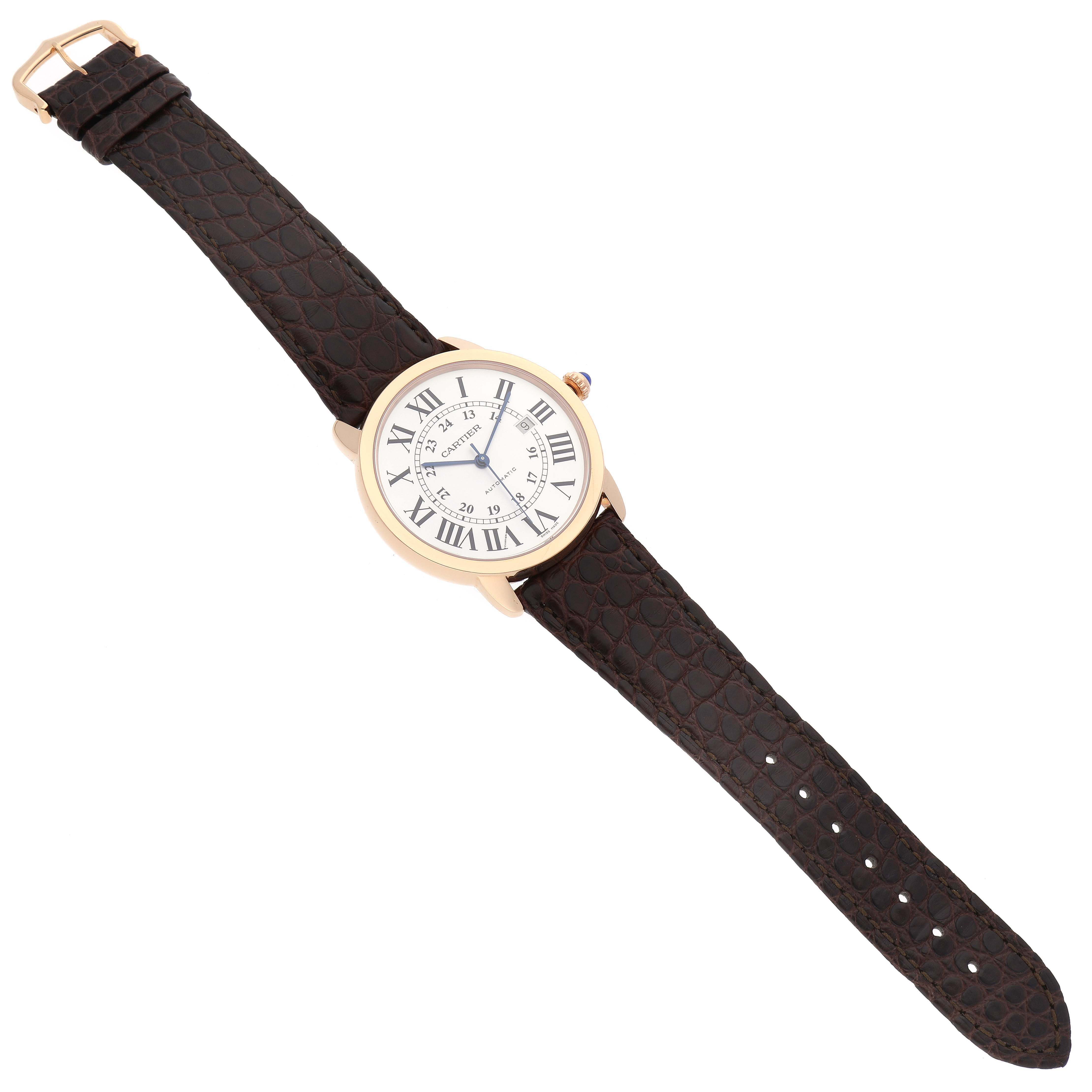 The image shows a top-down view of the Ronde model watch by Cartier, featuring a white dial with Roman numerals and a brown leather strap.