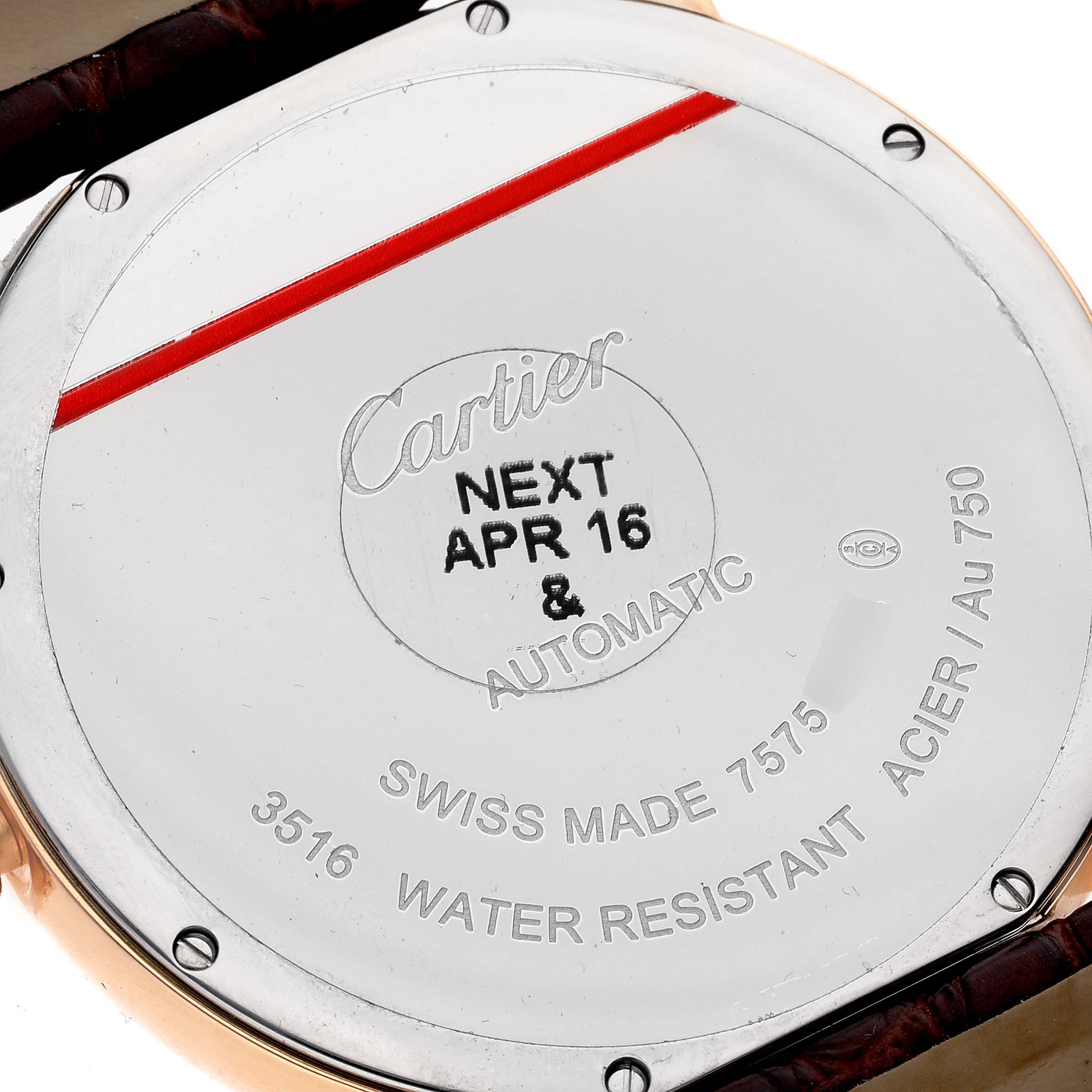 The image shows the back case of a Cartier Ronde W6701009 Men
s Yellow Gold Silver Dial W6701009 Men
s Yellow Gold Silver Dial model watch, displaying engraved details and screws.