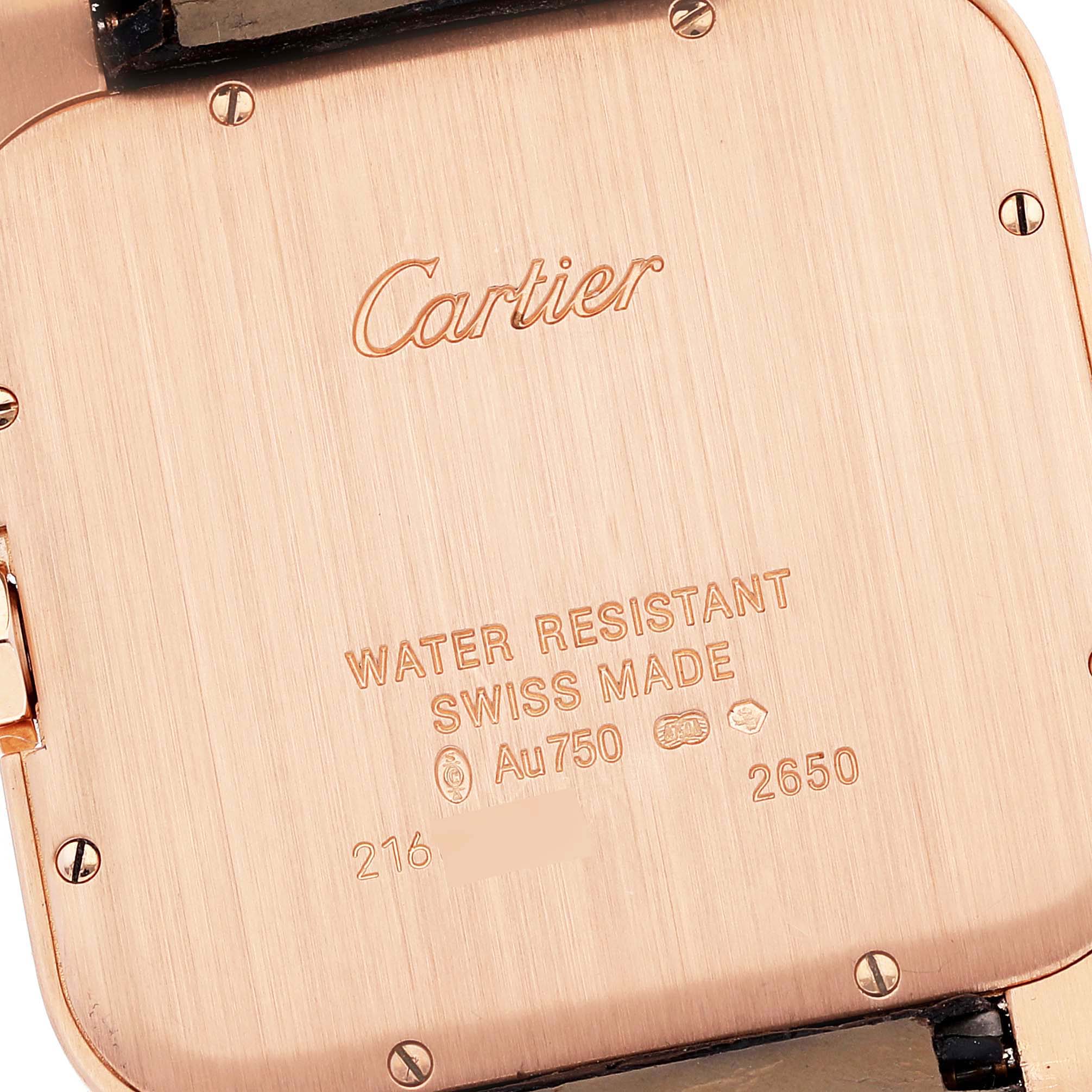 This image shows the back of a Cartier Santos Dumont W2006951 Men's Rose Gold Silver Dial W2006951 Men's Rose Gold Silver Dial watch, highlighting the brand name, water resistance, and Swiss-made markings.