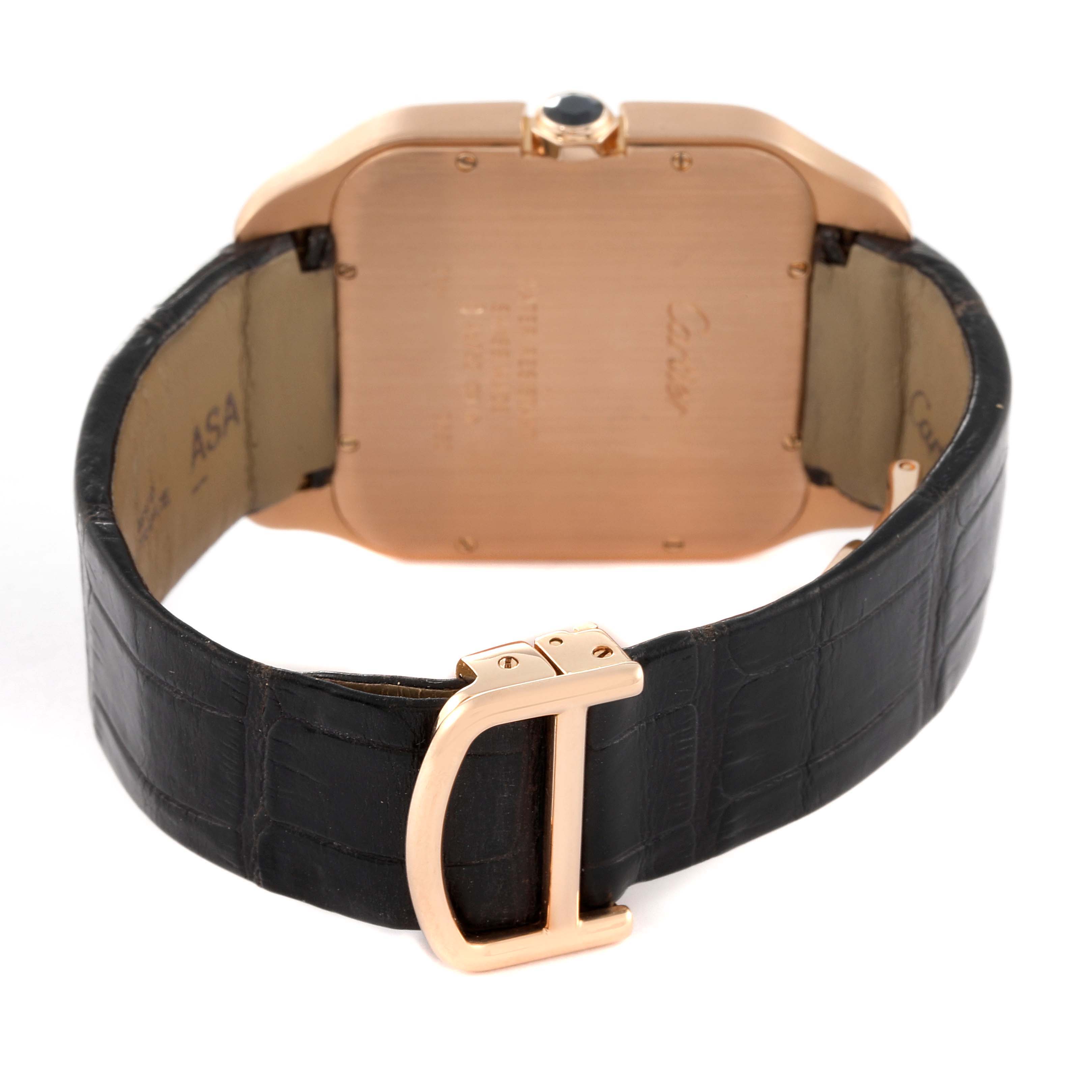 The image shows the back view of the Santos Dumont watch by Cartier with a focus on the clasp and strap.