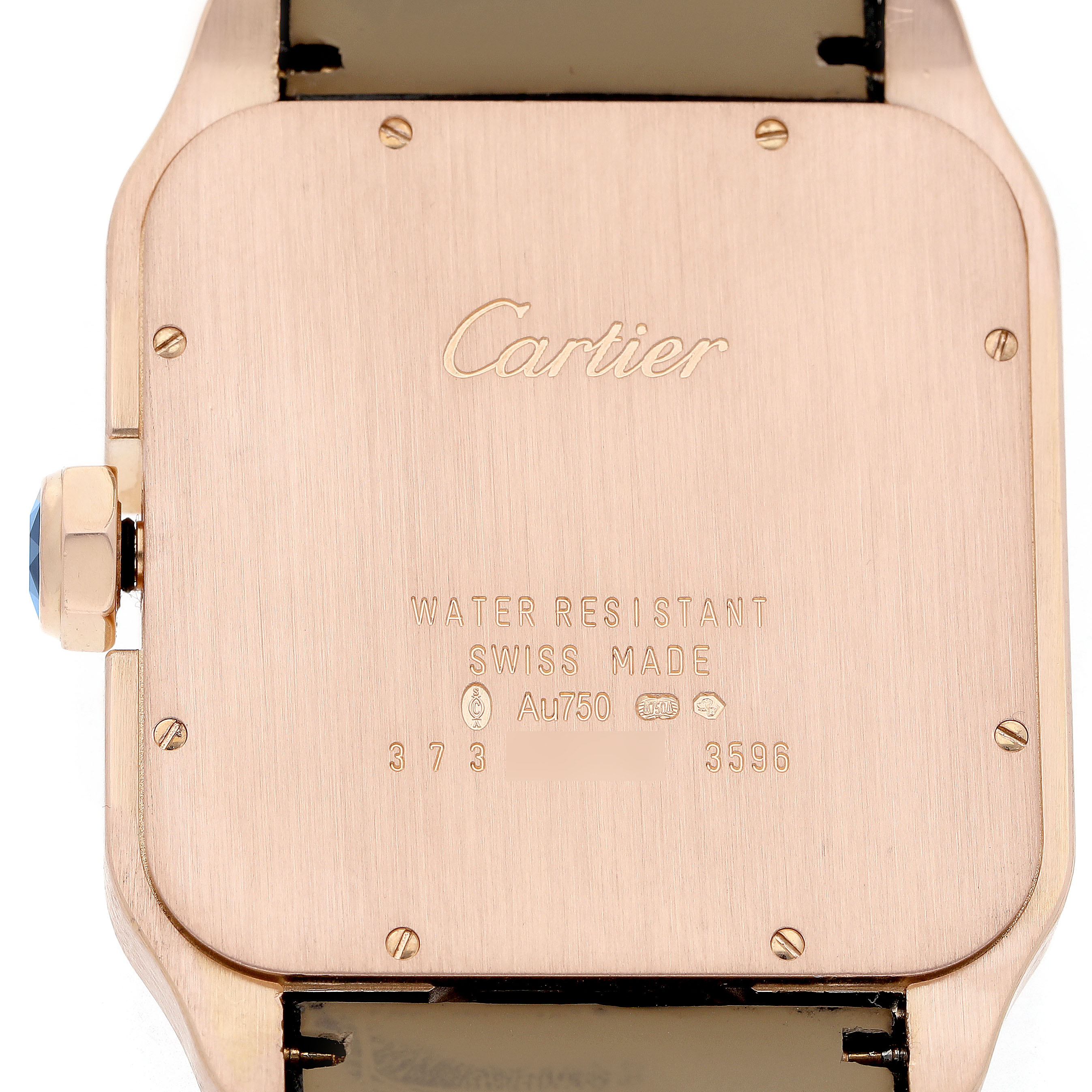 The image shows the back of a Cartier Santos Dumont W2020067 Men's Rose Gold Silver Dial watch, highlighting the engraving details and crown.