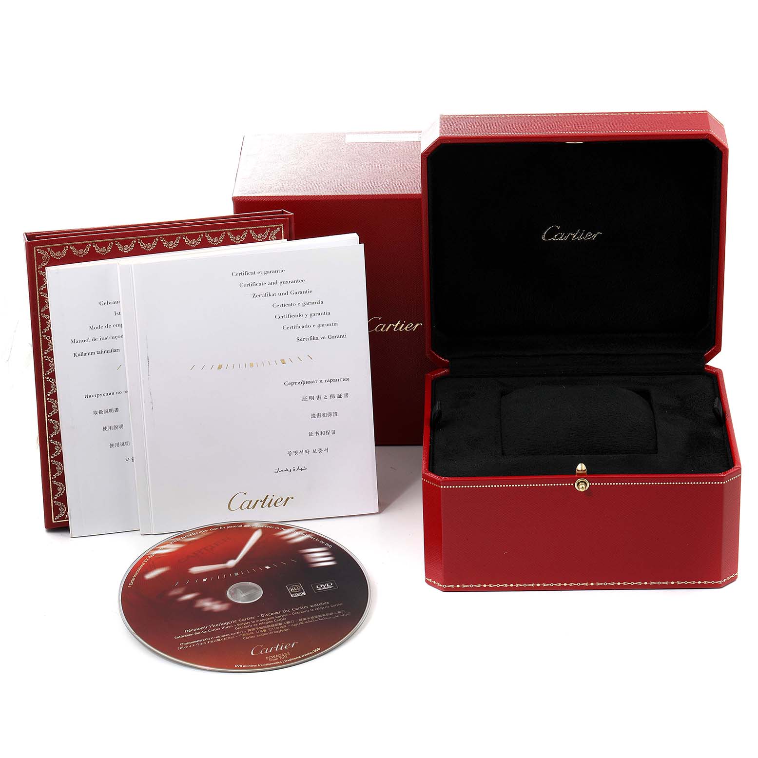 The image shows a Cartier Santos W20098D6 Men
s Stainless Steel Silver Dial W20098D6 Men
s Stainless Steel Silver Dial watch box, warranty certificates, and a CD, all arranged at a slightly elevated angle.