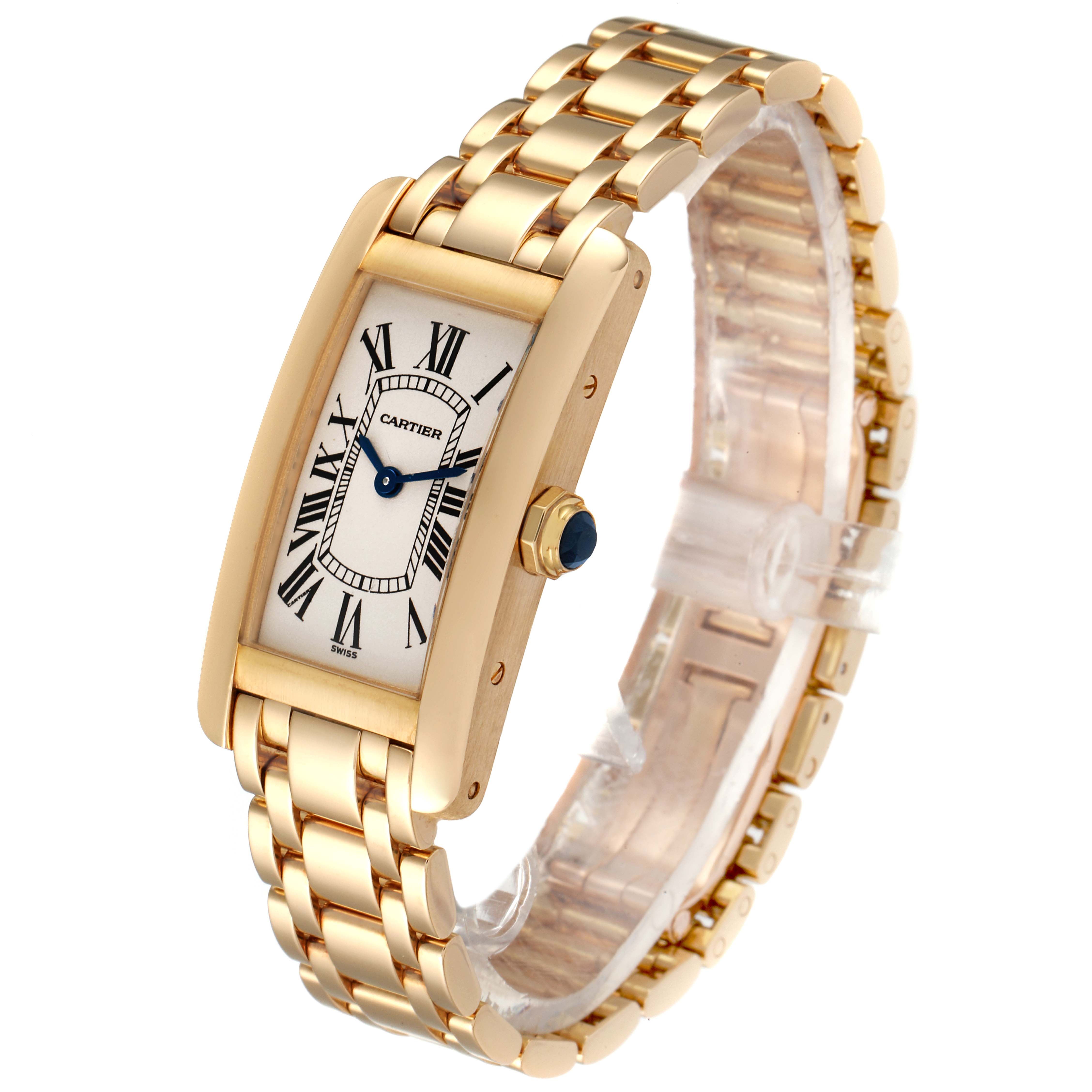 The Cartier Tank Américaine watch is angled toward the left, showcasing its gold rectangular case, white dial, Roman numerals, and bracelet.