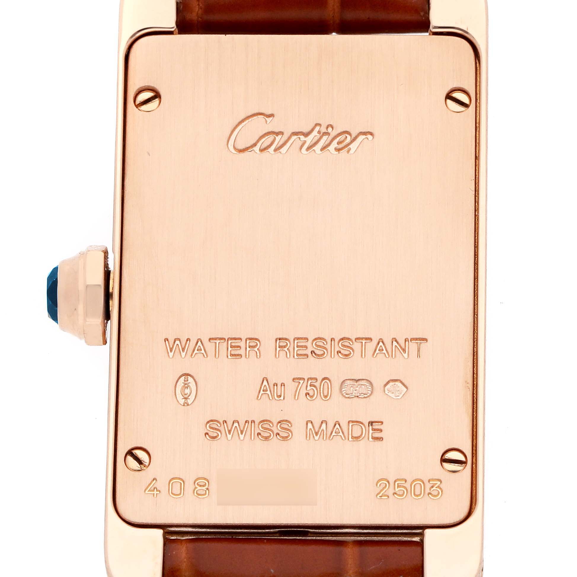 This image shows the back of a Cartier Tank Americaine W2607456 Women
s Rose Gold Silver Dial watch, including the engraved details and part of the leather strap.