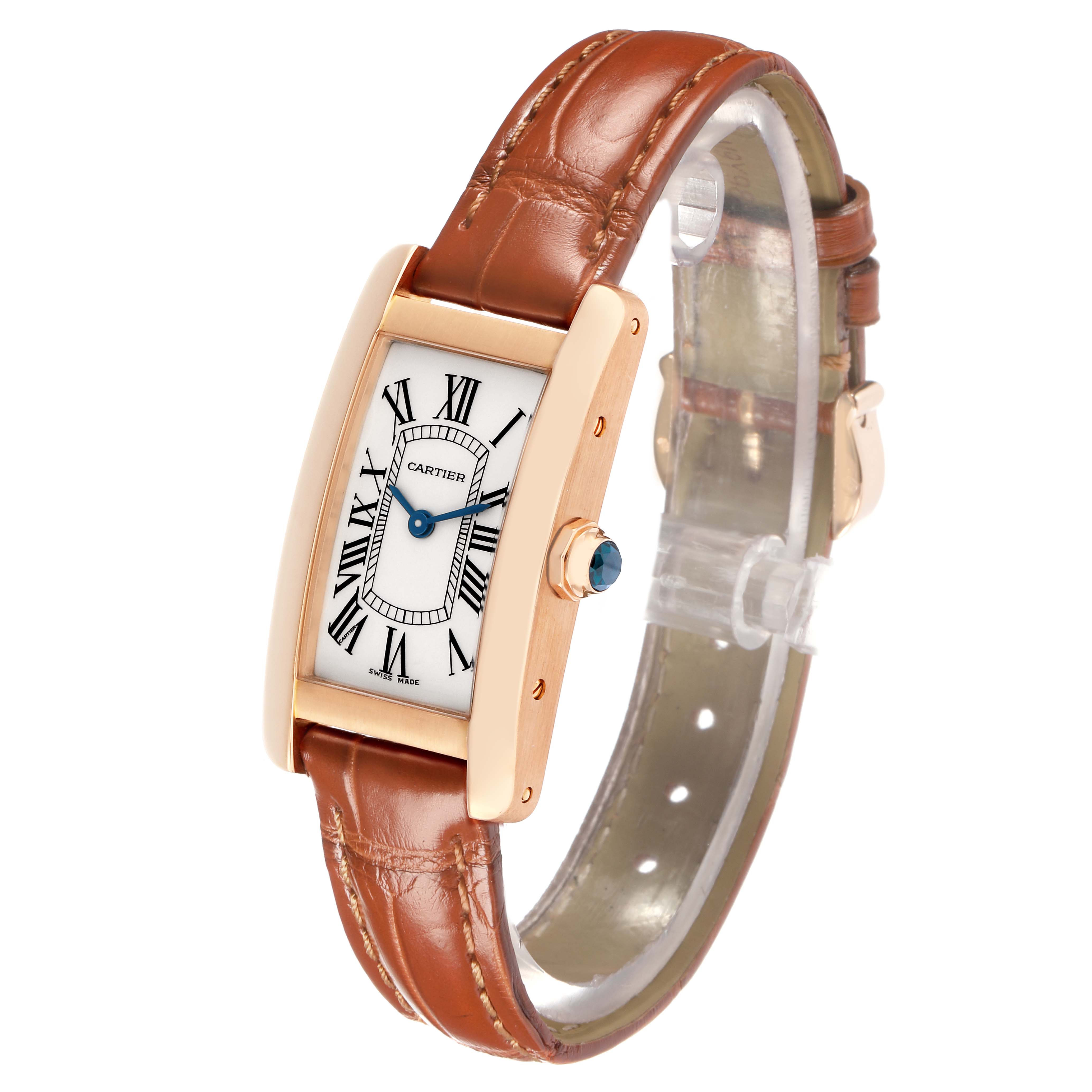 The Cartier Tank Américaine watch is shown at a slight angle, highlighting its rectangular face, leather strap, and side crown.