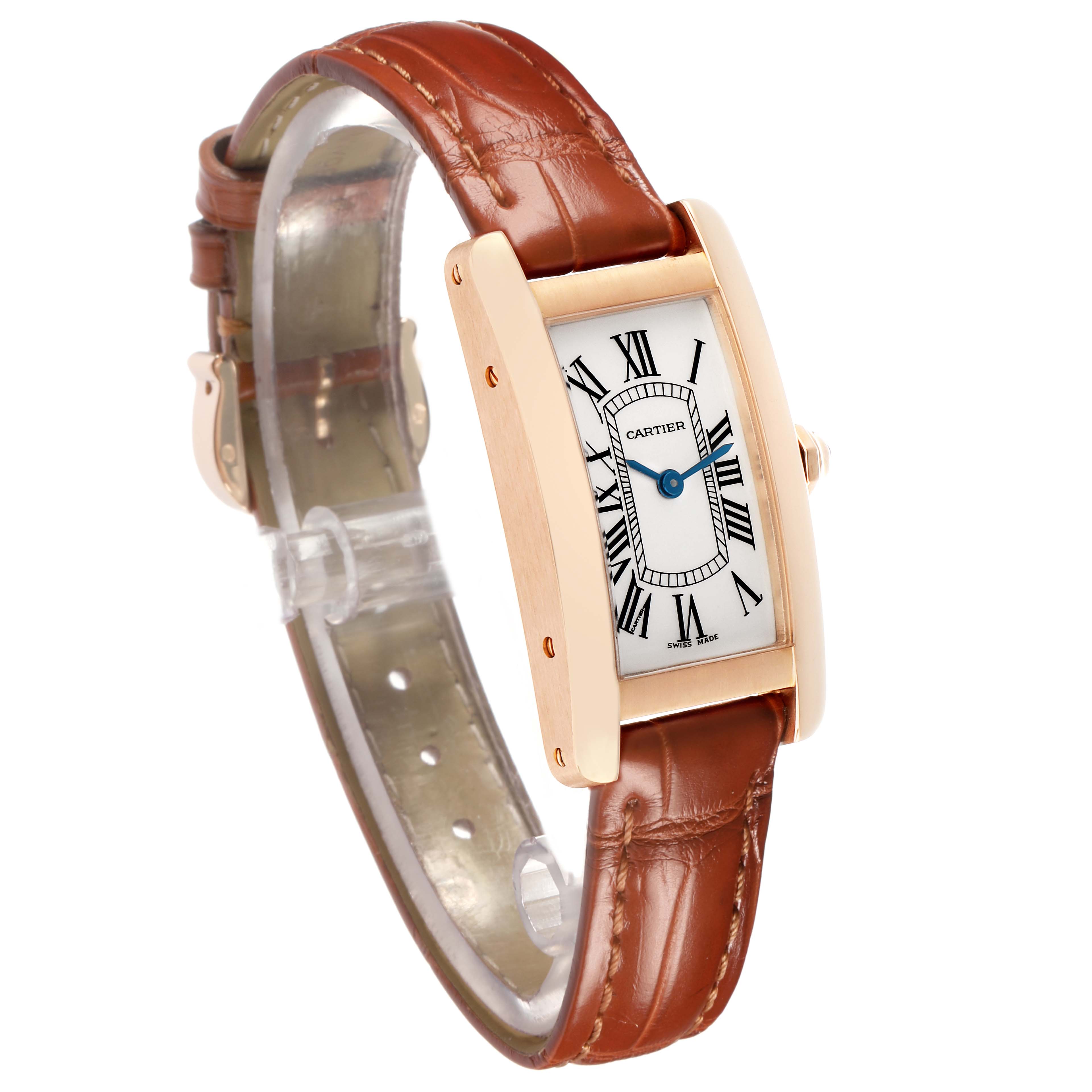 The Cartier Tank Américaine watch is shown at a three-quarter angle, highlighting its leather strap and rectangular case.