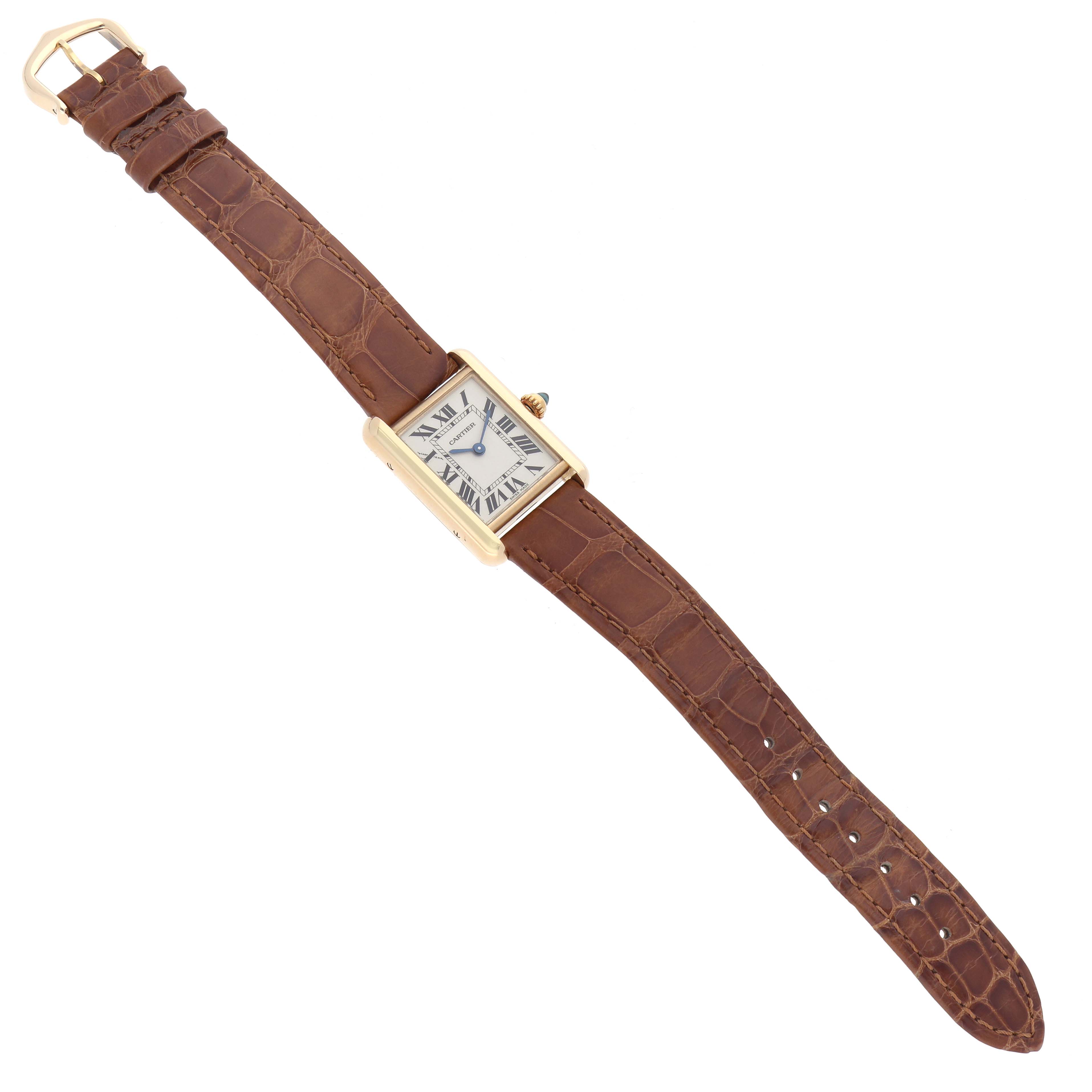 The Cartier Tank Louis W1529856 Women's Yellow Gold Silver Dial watch is shown from a top-down angle, highlighting its rectangular face, gold case, and brown leather strap.