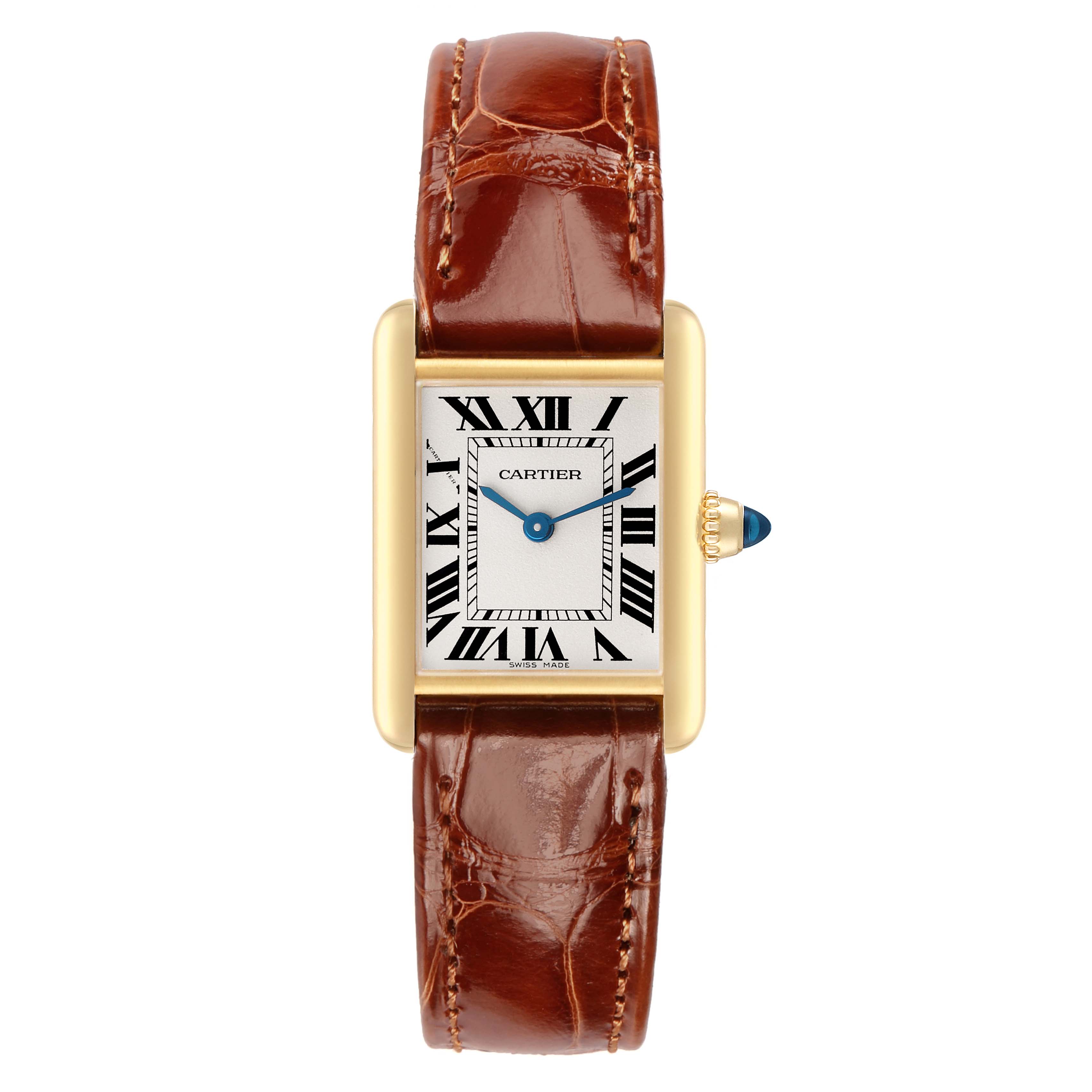 The Cartier Tank Louis W1529856 Women's Yellow Gold Silver Dial watch is shown from a top-down angle, featuring its face, Roman numerals, and brown leather strap.