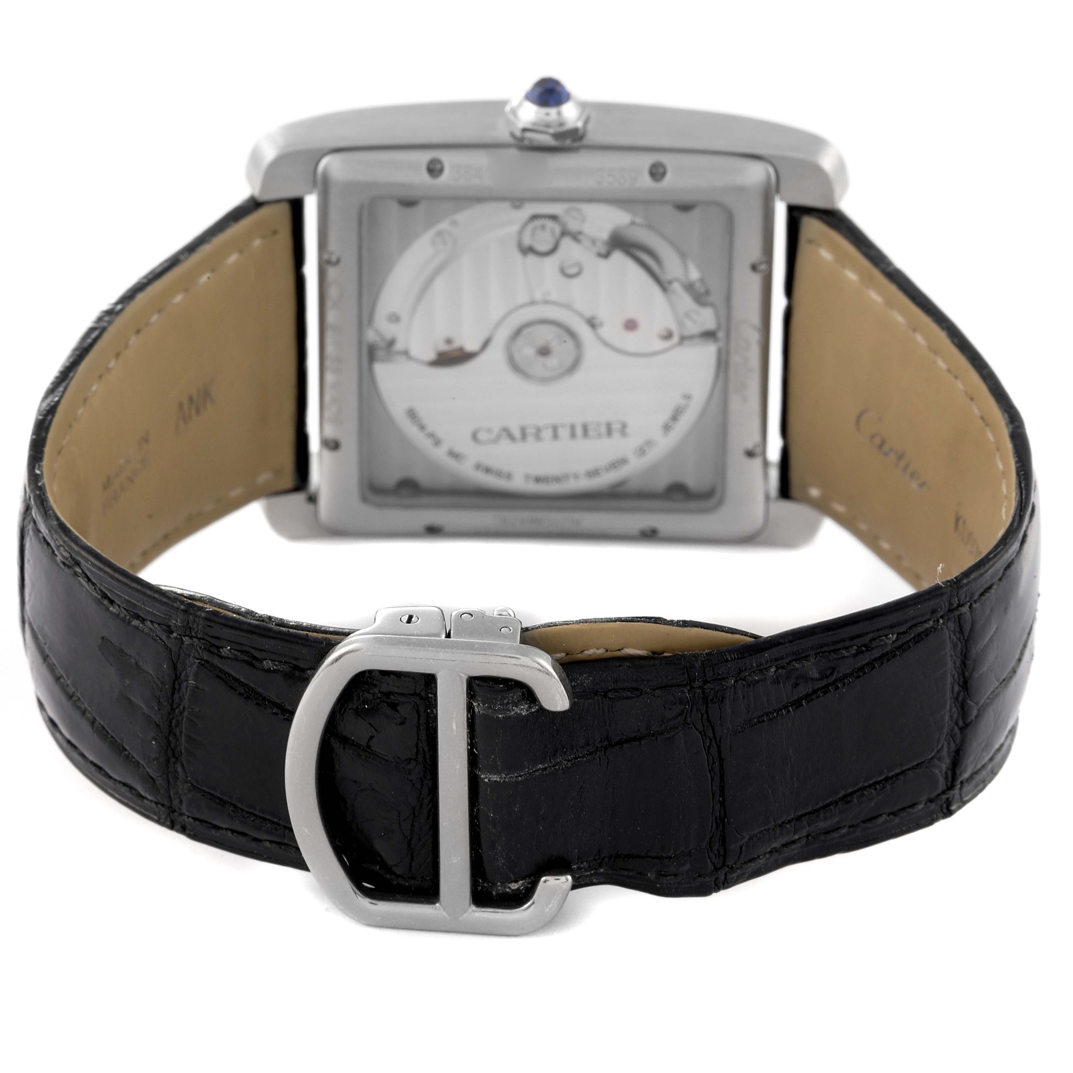 The image shows the back view of the Cartier Tank MC W5330004 Men's Stainless Steel Black Dial W5330004 Men's Stainless Steel Black Dial watch, highlighting the movement and the black leather strap with a buckle.