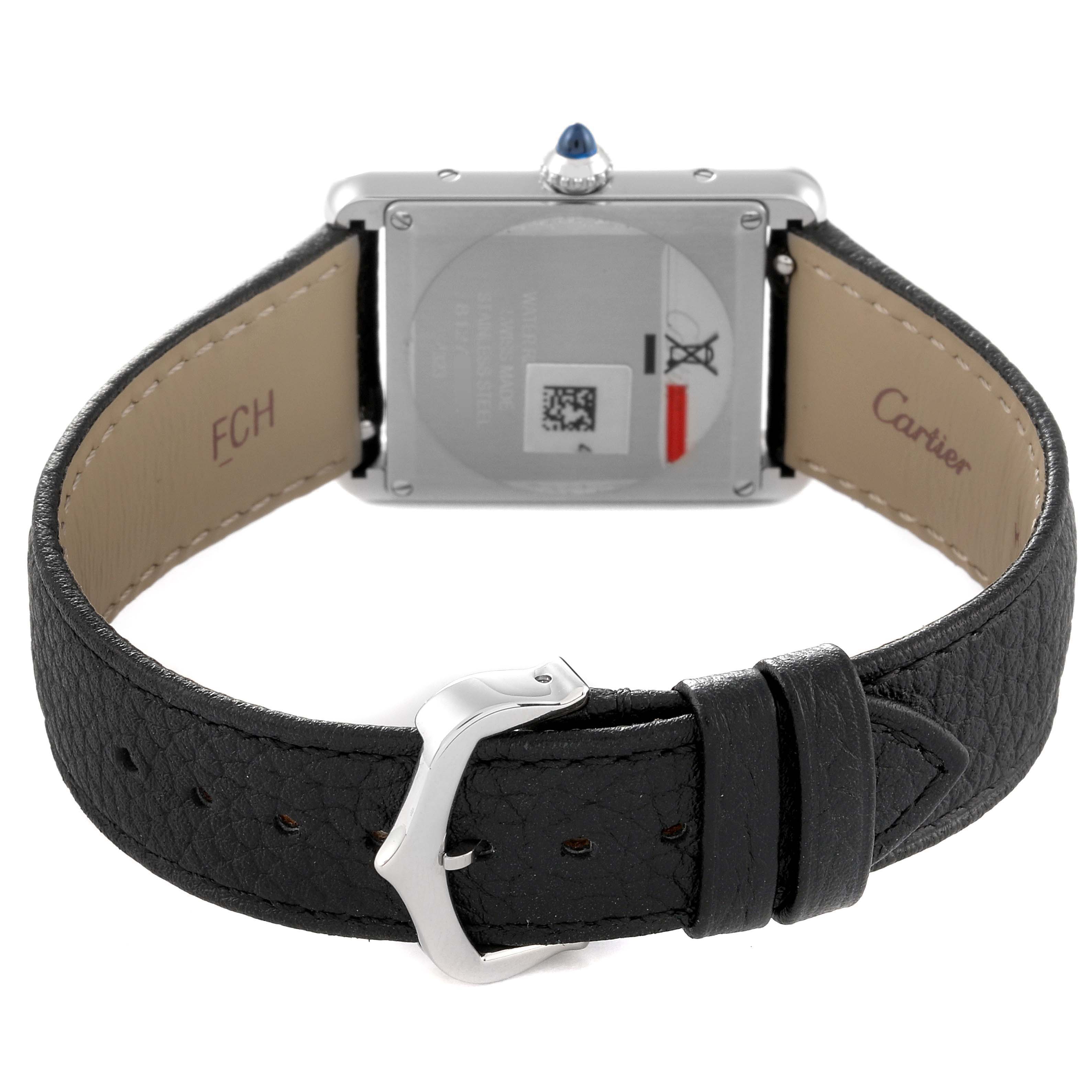 The image shows the back view of a Cartier Tank Must WSTA0041 Women's Stainless Steel Silver Dial WSTA0041 Women's Stainless Steel Silver Dial watch, displaying the clasp, case back, and leather strap.