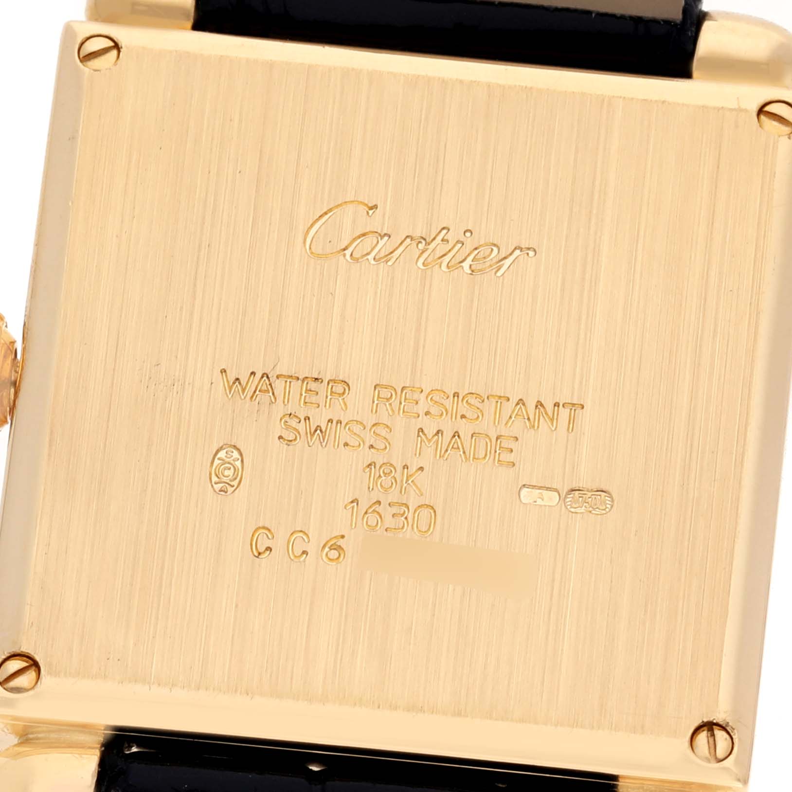 This image shows the back case of a Cartier Tank Obus WB800251 Women's Yellow Gold Silver Dial WB800251 Women's Yellow Gold Silver Dial watch, displaying its engraving details.