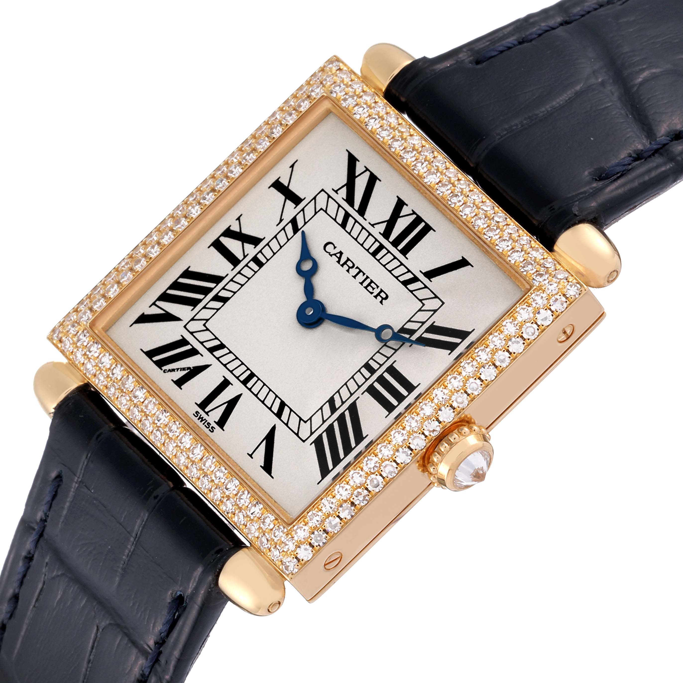 The image shows a Cartier Tank Obus WB800251 Women's Yellow Gold Silver Dial WB800251 Women's Yellow Gold Silver Dial watch angled upwards, highlighting its diamond-set bezel, blue strap, and Roman numeral dial.