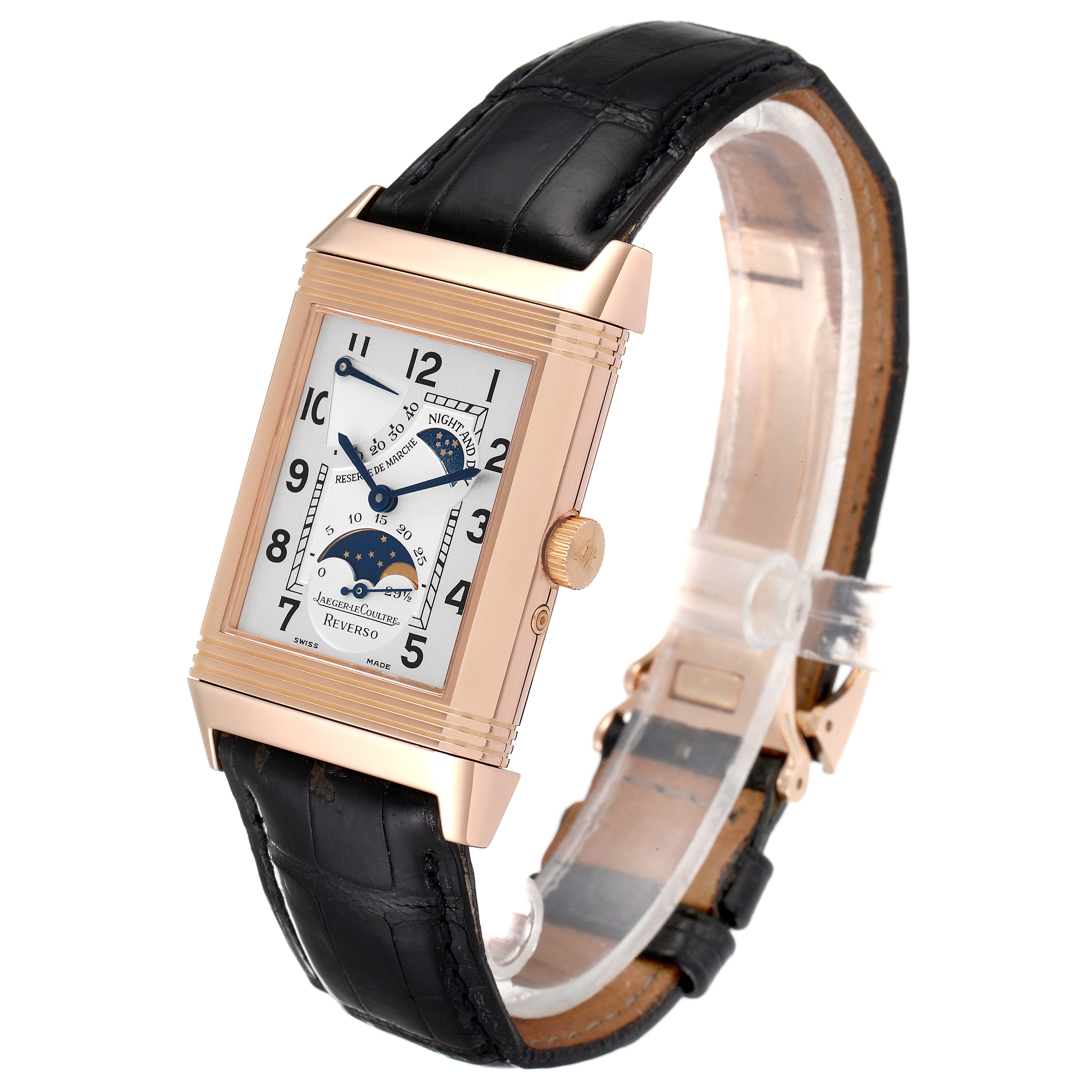 The image shows a Jaeger LeCoultre Reverso Q2752420 Men
s Rose Gold Silver Dial Q2752420 Men
s Rose Gold Silver Dial watch at a tilted angle displaying its rectangular face, crown, and black leather strap.