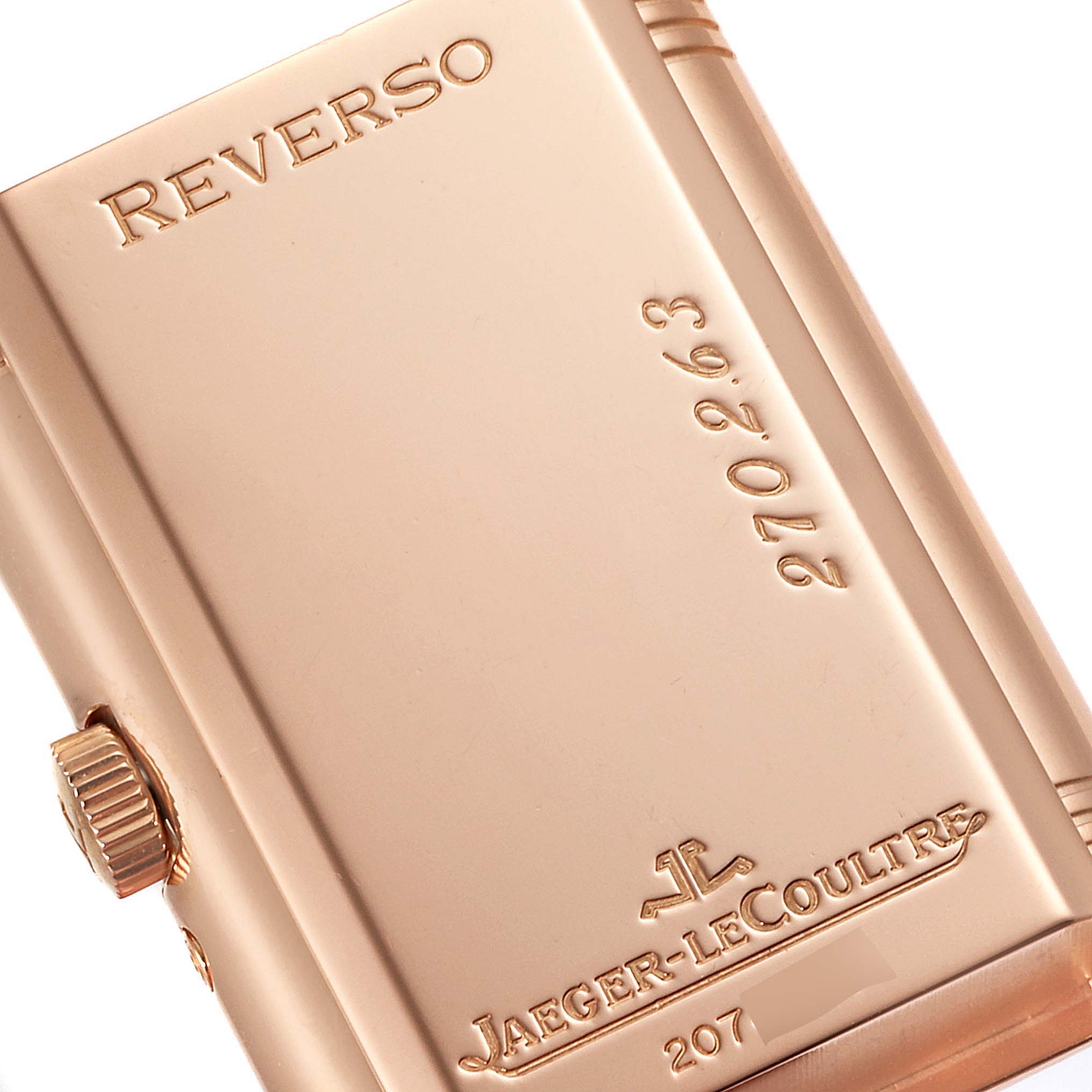 The image shows a close-up of the back case of a Jaeger-LeCoultre Reverso watch, highlighting the brand and model engraving.