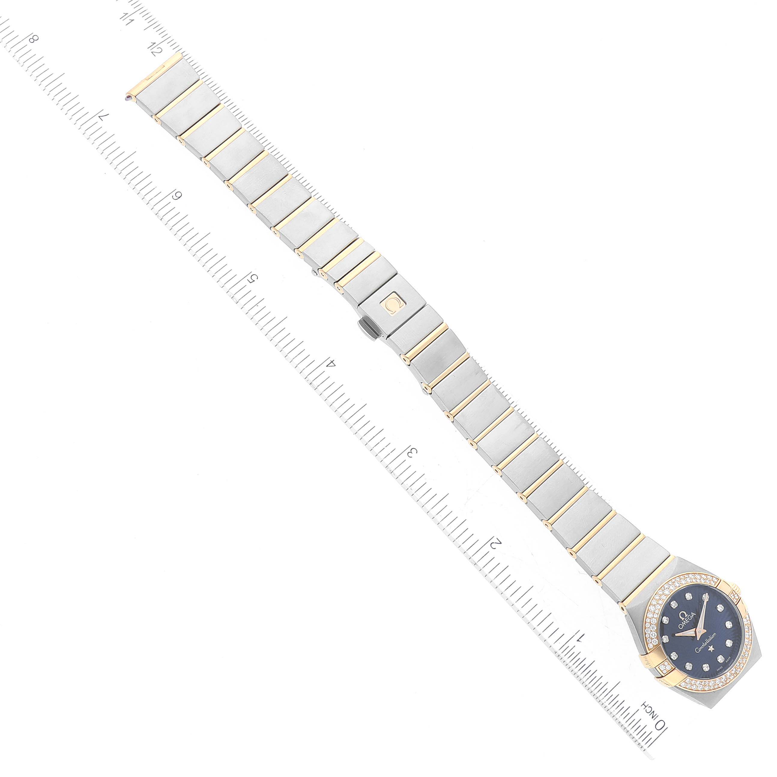 The Omega 123.25.24.60.53.001 Women's Steel and Gold (two tone) Blue Dial 123.25.24.60.53.001 Women's Steel and Gold (two tone) Blue Dial Constellation Steel Rose Gold Diamond Ladies Watch 123.25.24.60.53.001 is shown from an overhead angle with its full bracelet and face visible.
