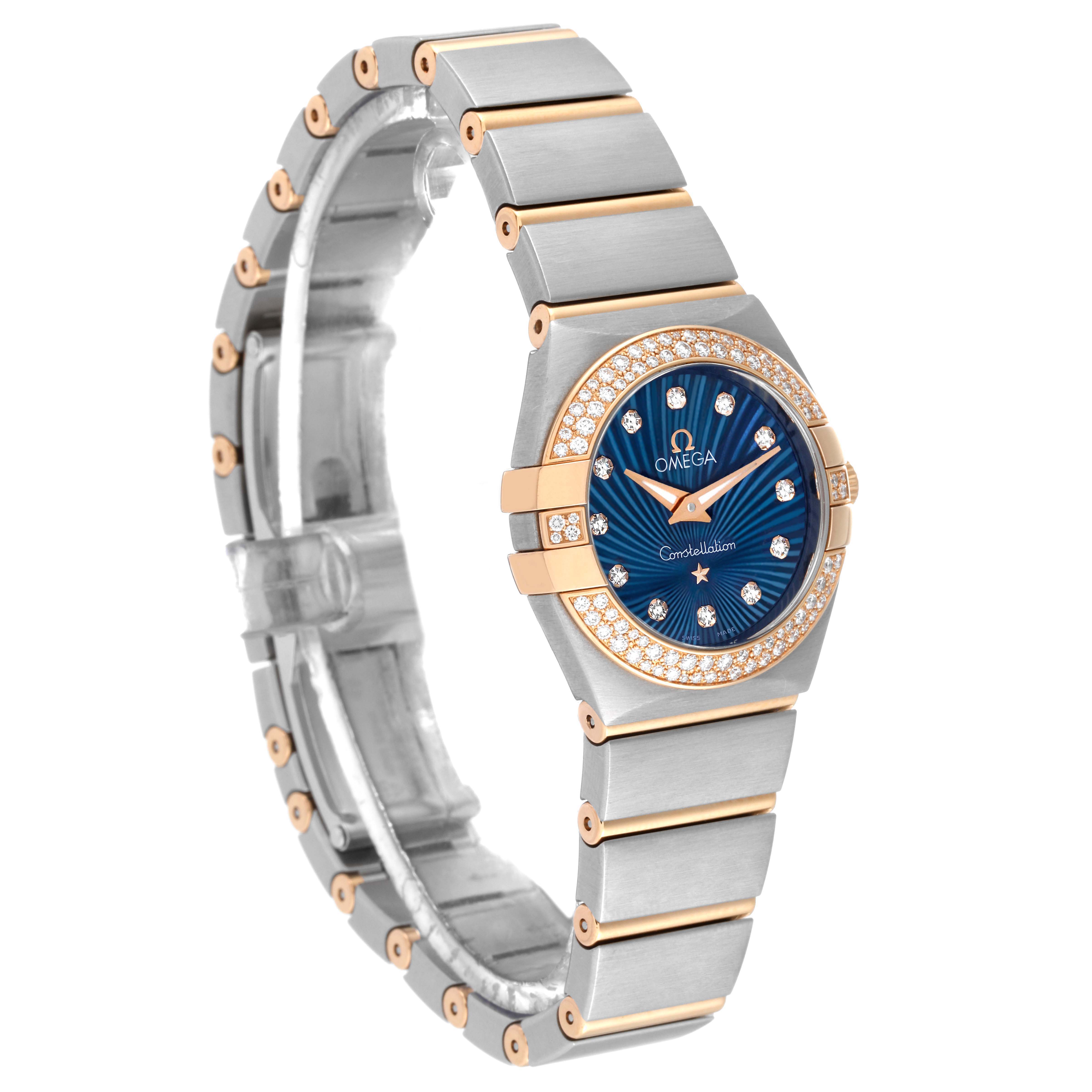 The image shows a side angle of the Omega 123.25.24.60.53.001 Women's Steel and Gold (two tone) Blue Dial 123.25.24.60.53.001 Women's Steel and Gold (two tone) Blue Dial Constellation Steel Rose Gold Diamond Ladies Watch, model 123.25.24.60.53.001, highlighting the bracelet and dial.