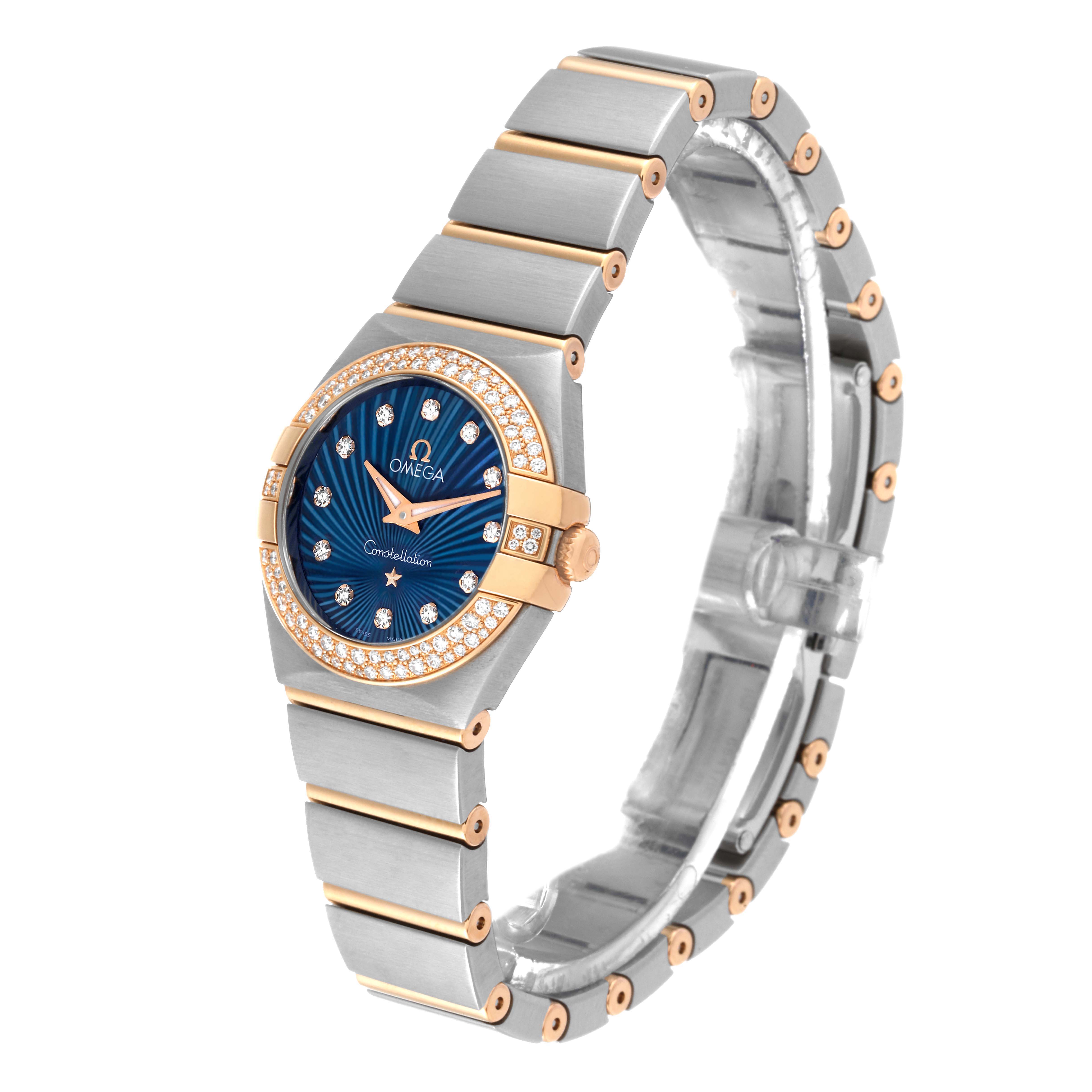 This image shows an Omega 123.25.24.60.53.001 Women's Steel and Gold (two tone) Blue Dial 123.25.24.60.53.001 Women's Steel and Gold (two tone) Blue Dial Constellation Steel Rose Gold Diamond Ladies Watch (model 123.25.24.60.53.001) at a tilted front angle.