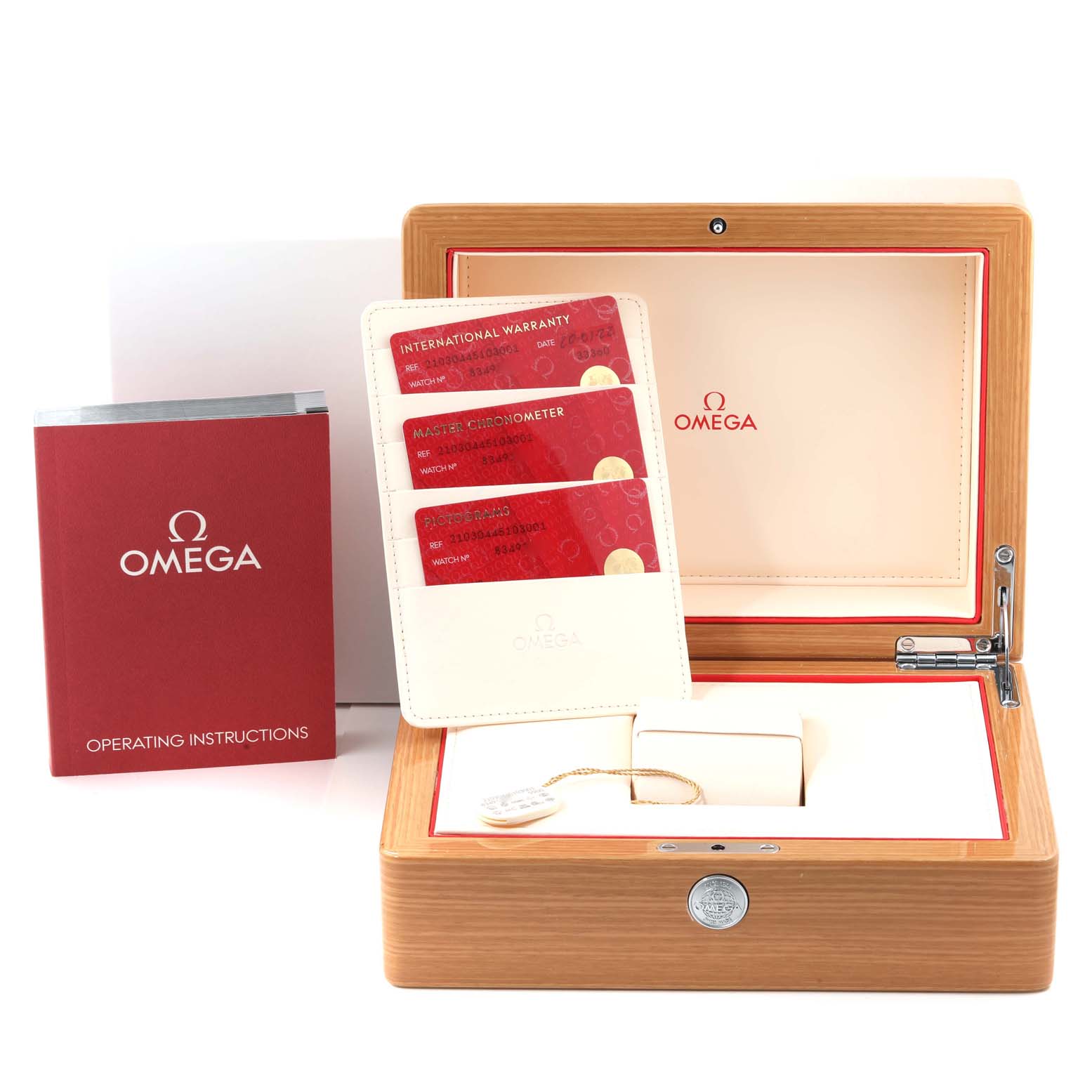 The image shows the packaging, warranty cards, and operating instructions for an Omega Seamaster 210.30.44.51.03.001 Men's Stainless Steel Blue Dial 210.30.44.51.03.001 Men's Stainless Steel Blue Dial watch.