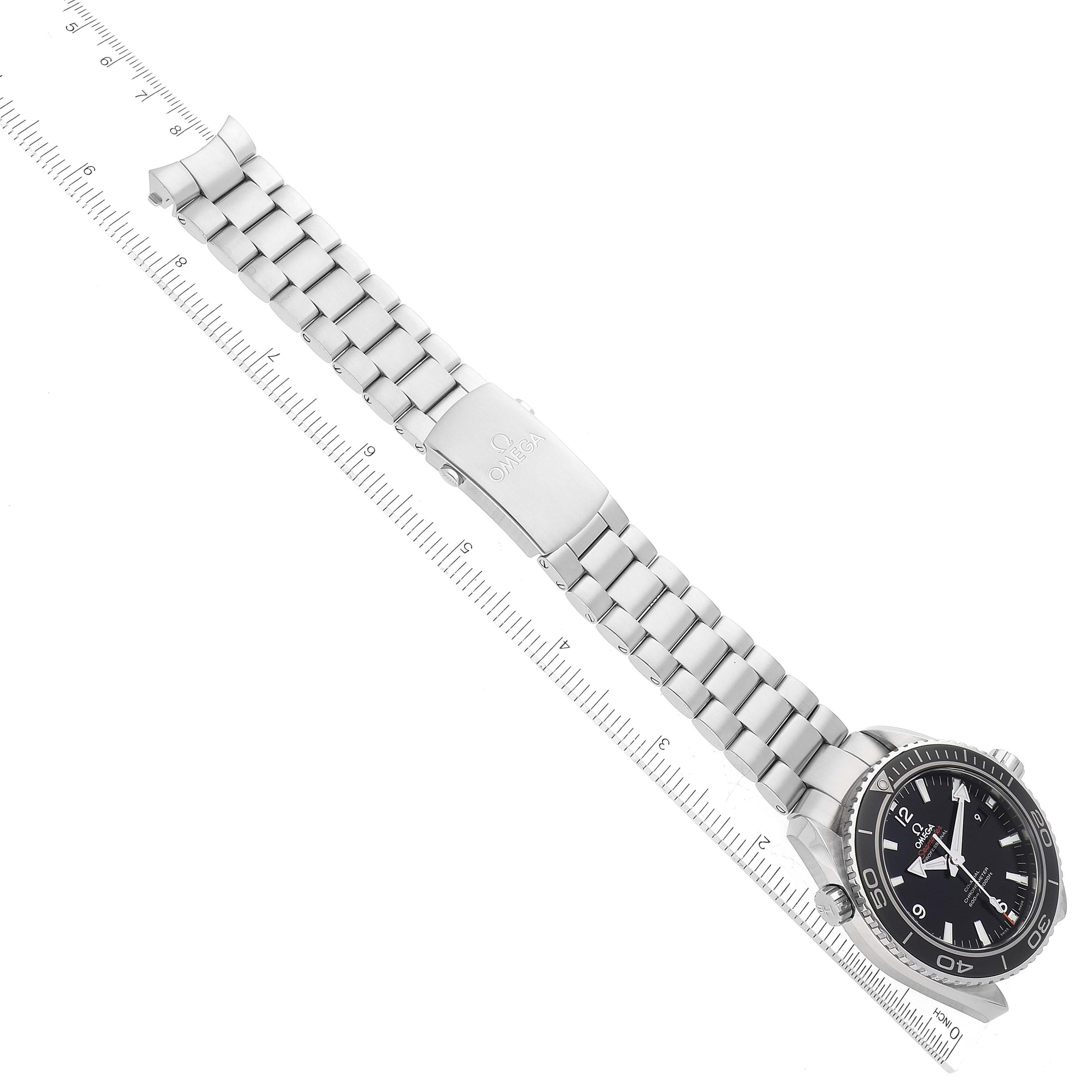 The image shows the Omega Planet Ocean 232.30.46.21.01.001 Men
s Stainless Steel Black Dial 232.30.46.21.01.001 Men
s Stainless Steel Black Dial watch viewed from above, fully extended with its stainless steel bracelet and clasp visible.