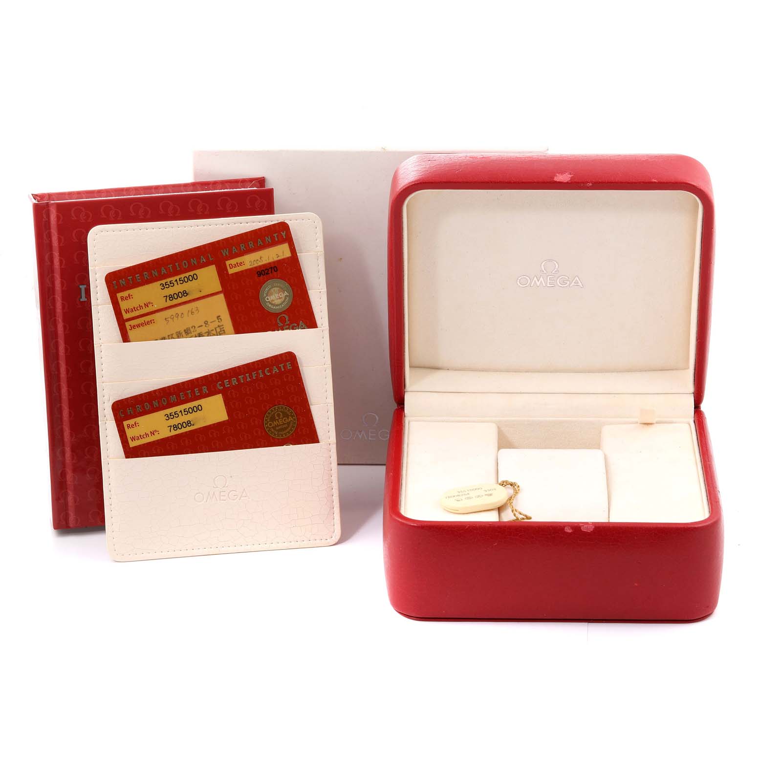 The image shows the accessories for an Omega Speedmaster 3551.50.00 Men's Stainless Steel Black Dial 3551.50.00 Men's Stainless Steel Black Dial watch, including the warranty cards, booklet, and an empty watch box.