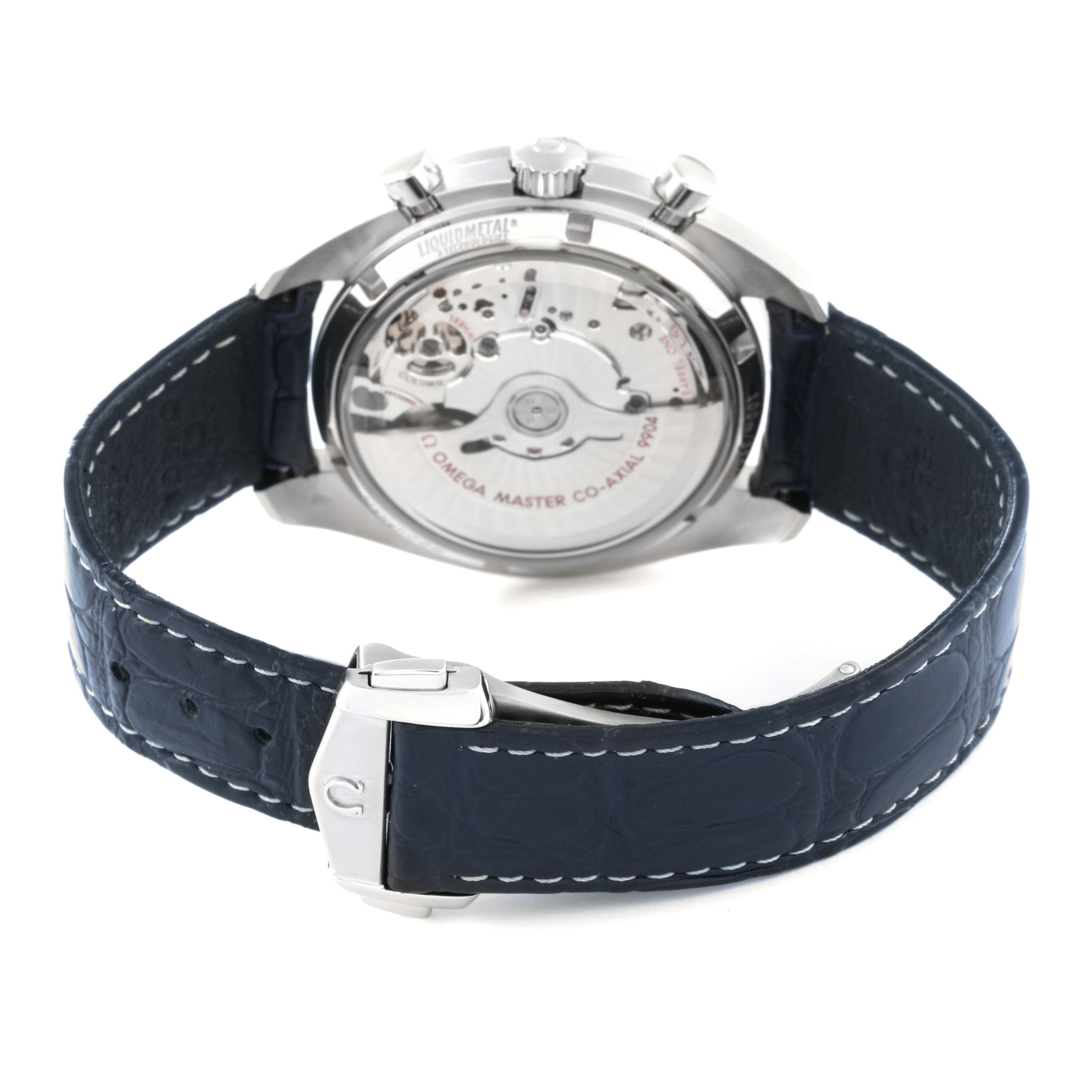 This image shows the back of an Omega Speedmaster 304.33.44.52.03.001 Men's Stainless Steel Blue Dial 304.33.44.52.03.001 Men's Stainless Steel Blue Dial watch, displaying its movement and blue strap with a clasp.