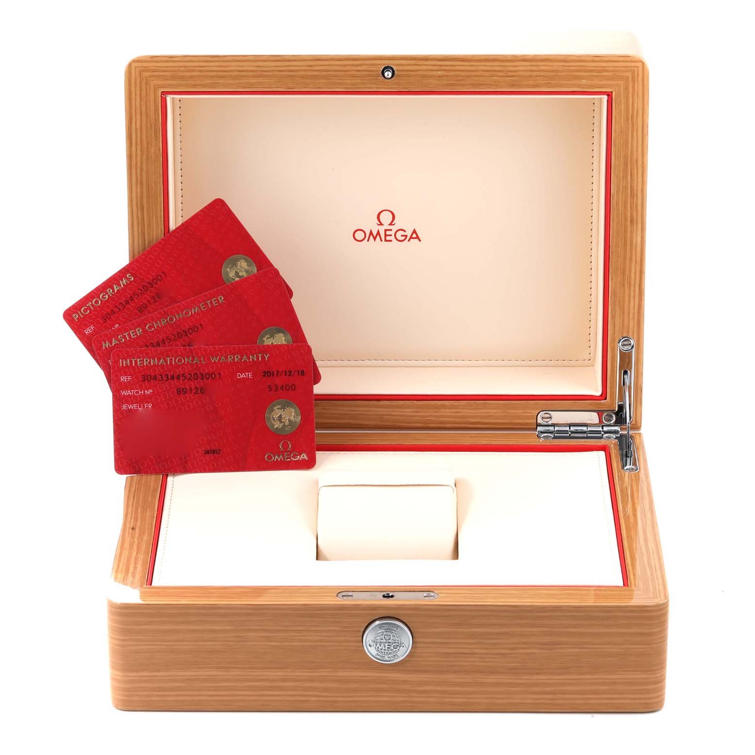 The image shows the open wooden box of an Omega Speedmaster 304.33.44.52.03.001 Men's Stainless Steel Blue Dial 304.33.44.52.03.001 Men's Stainless Steel Blue Dial, with warranty cards, cushion, and detailed Omega logo inside.