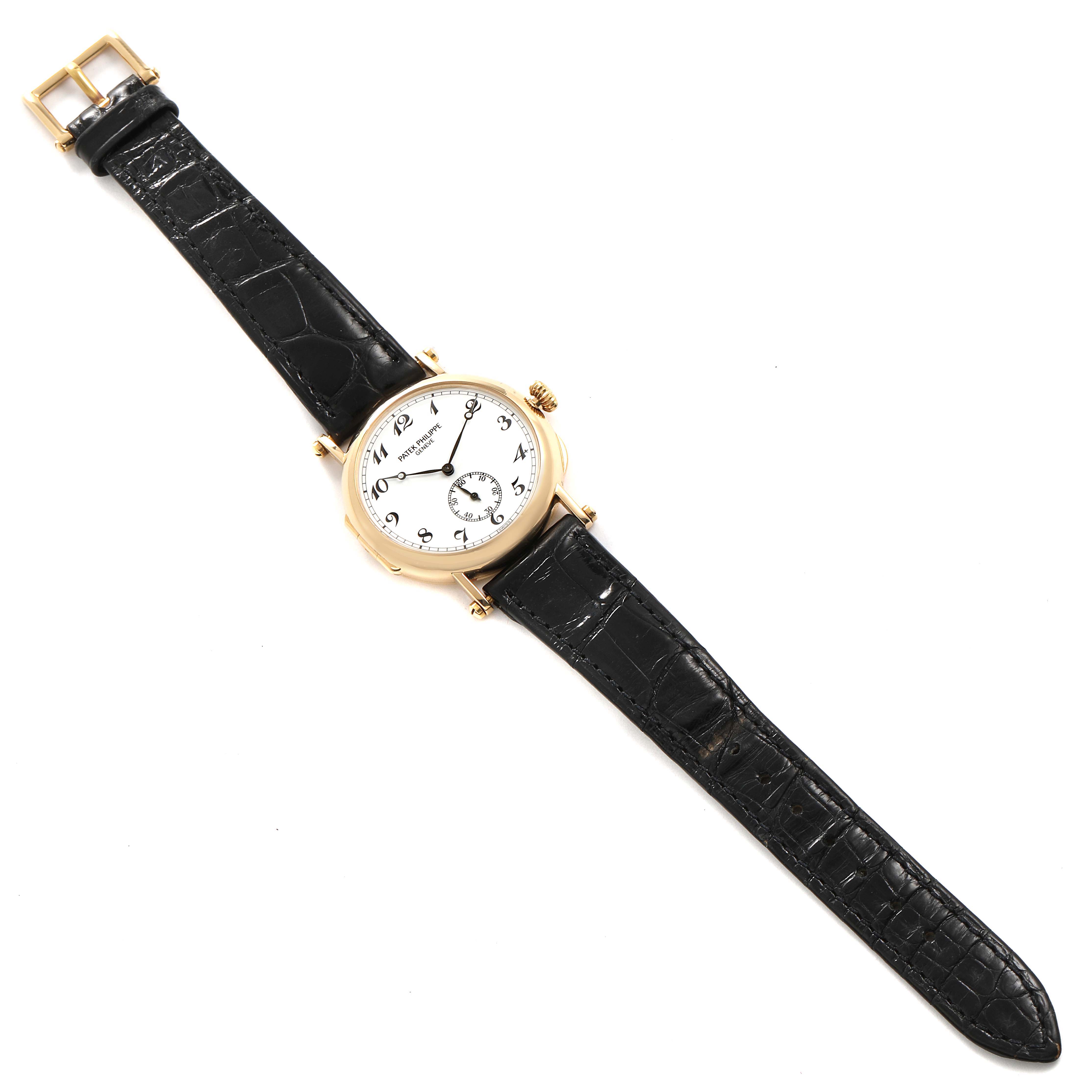 This image shows a top-down view of a Patek Philippe Calatrava 3960J Men's Yellow Gold White Dial 3960J Men's Yellow Gold White Dial watch with a white dial and black leather strap.