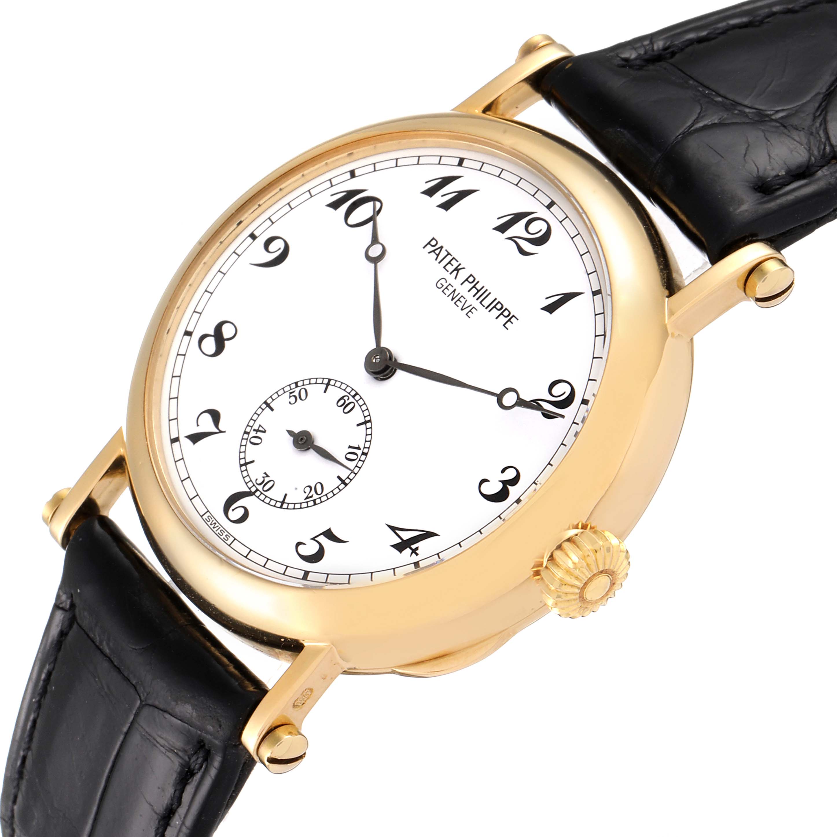 The image shows a Calatrava model by Patek Philippe with a gold case, white dial, black leather strap, and viewed from a slightly angled top-down shot.