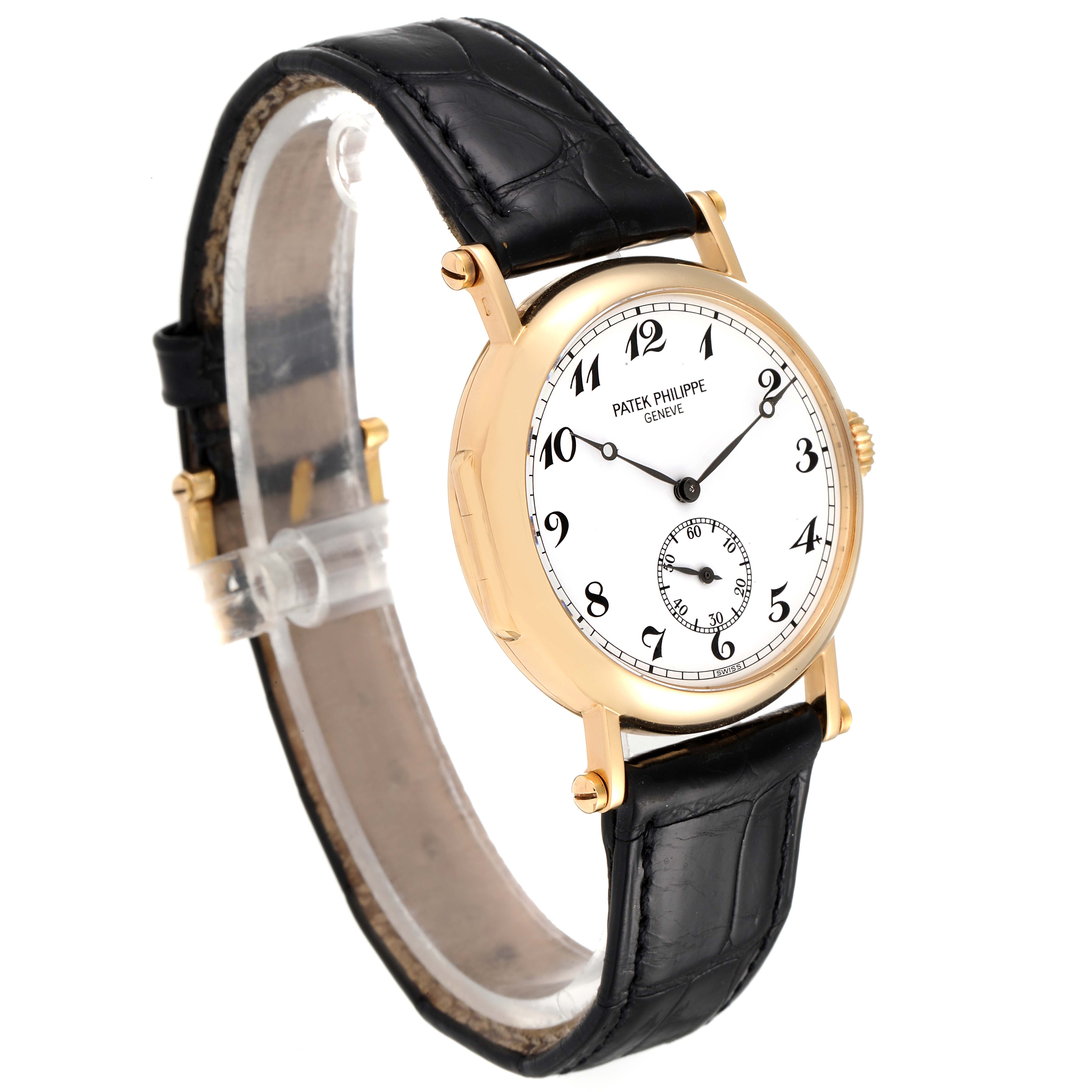 The image shows a side angle of a Patek Philippe Calatrava 3960J Men's Yellow Gold White Dial 3960J Men's Yellow Gold White Dial watch, highlighting its dial, leather strap, and gold case.