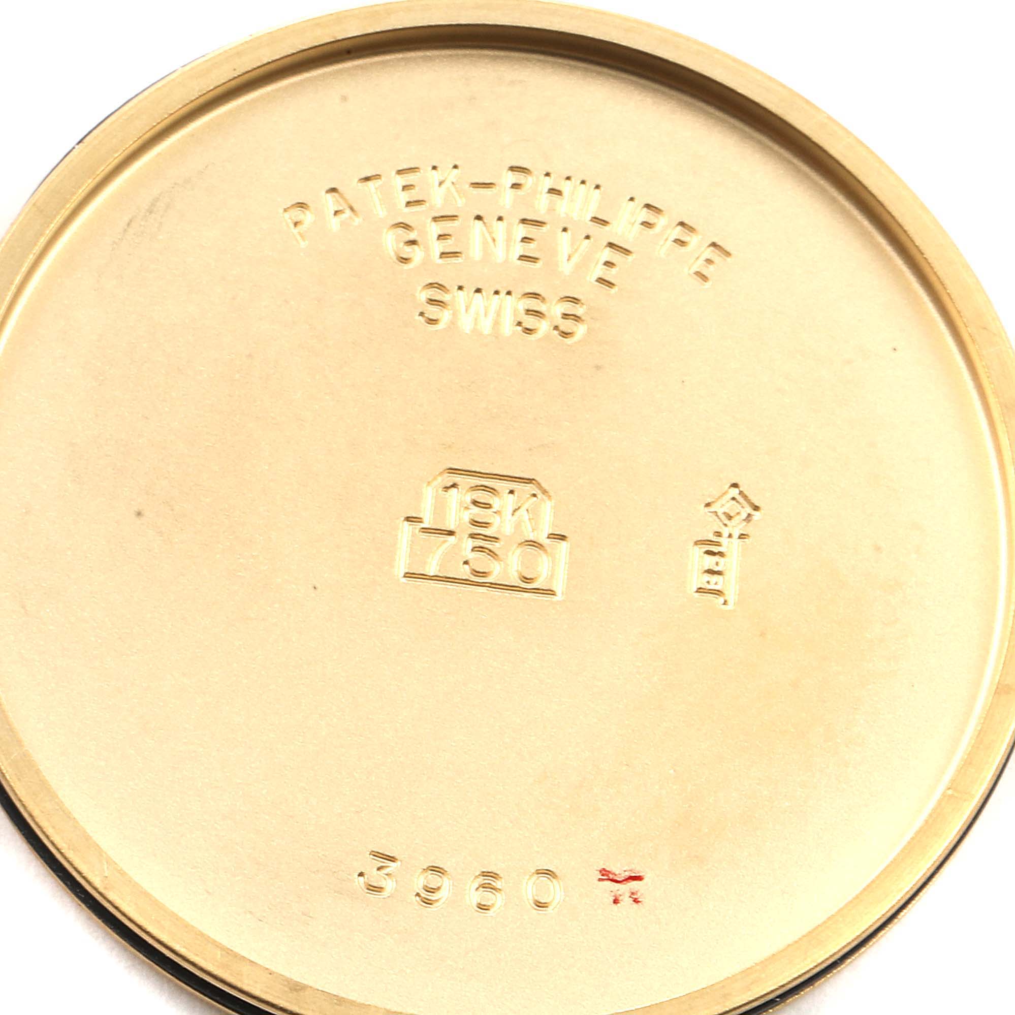 The image shows the interior back case of a Patek Philippe Calatrava 3960J Men's Yellow Gold White Dial 3960J Men's Yellow Gold White Dial model watch with engravings.