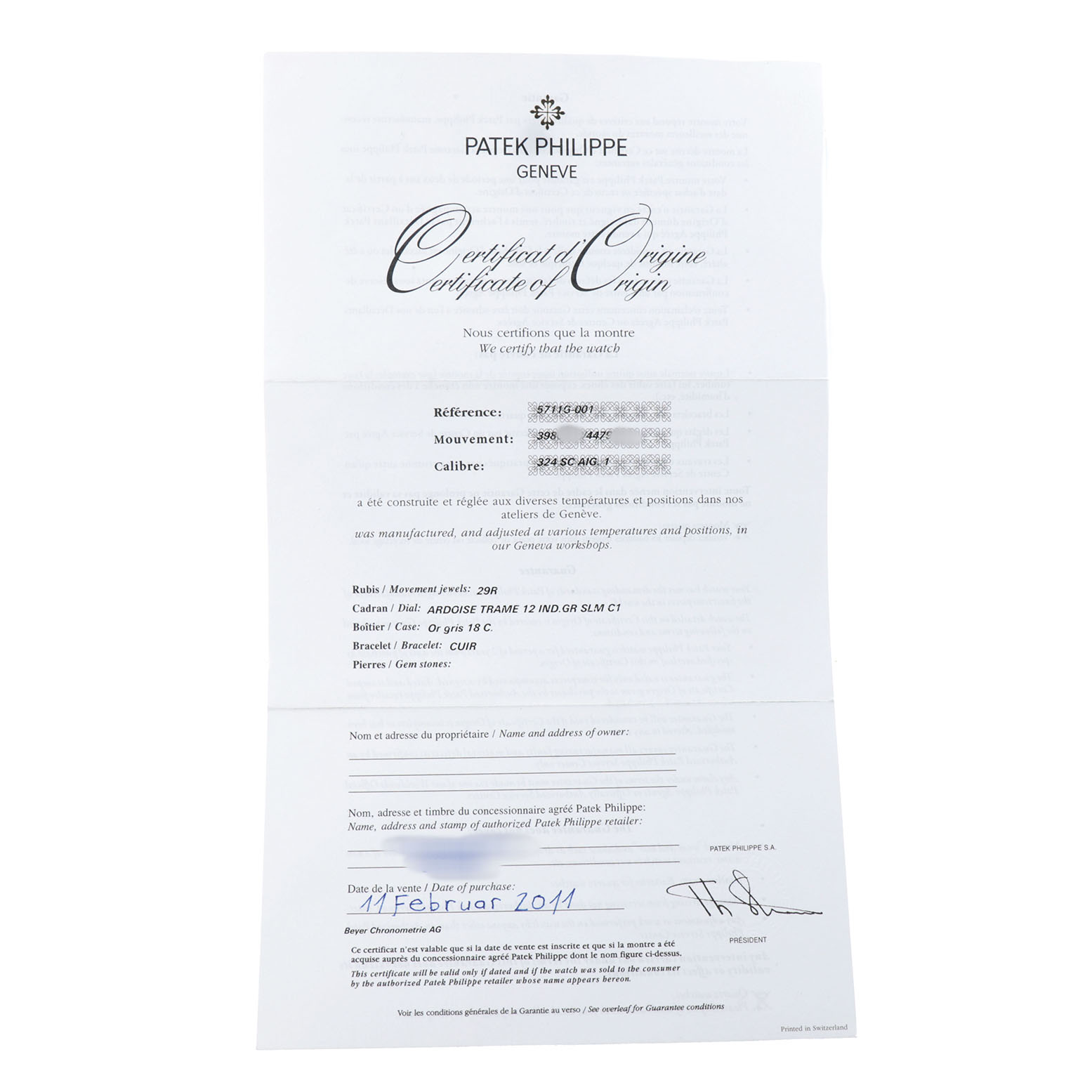 This image shows the Certificate of Origin for a Patek Philippe Nautilus 5711G-001 Men's White Gold Silver Dial watch, detailing reference, movement, and caliber.