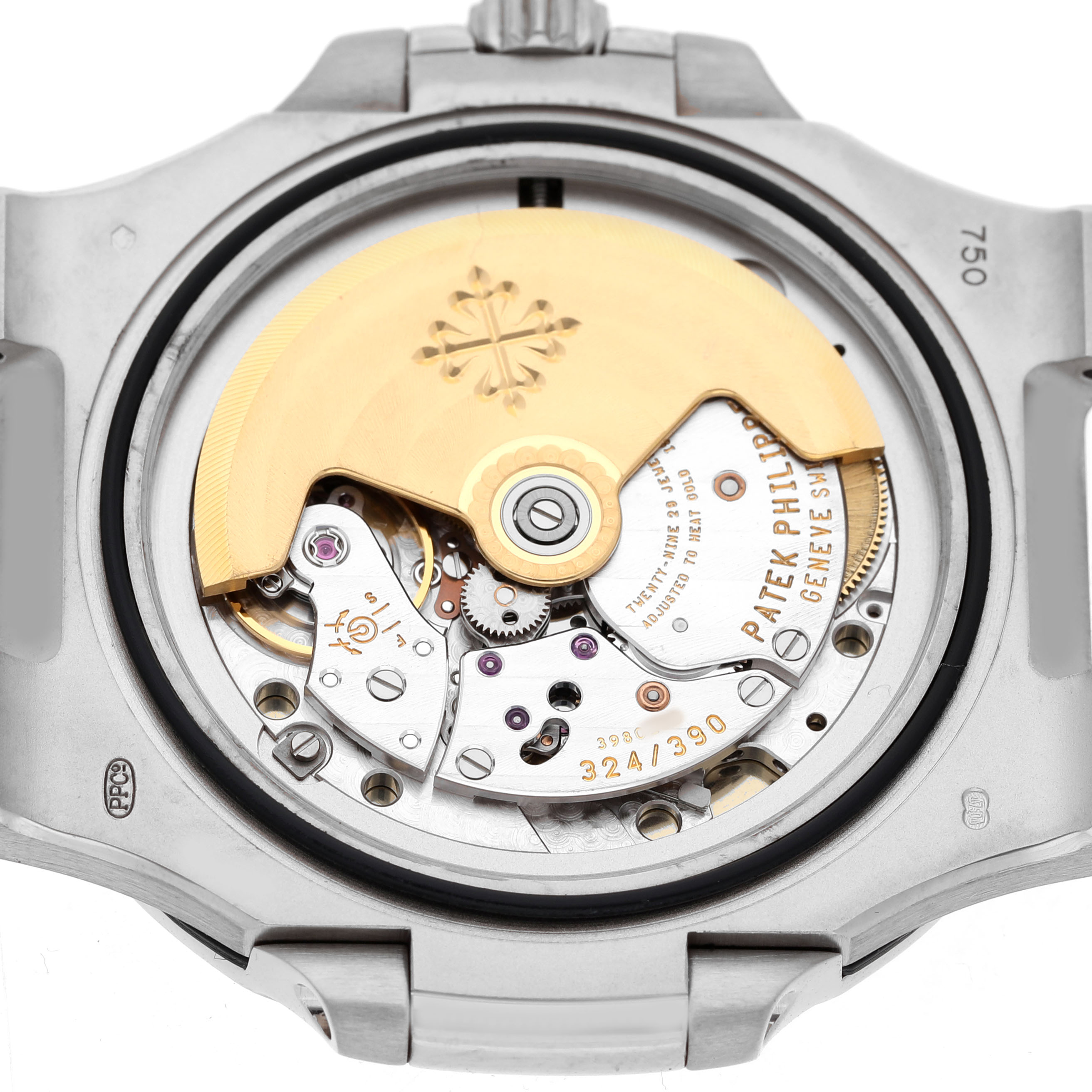 The image shows the case back of a Patek Philippe Nautilus 5711G-001 Men's White Gold Silver Dial, revealing its intricate movement components.