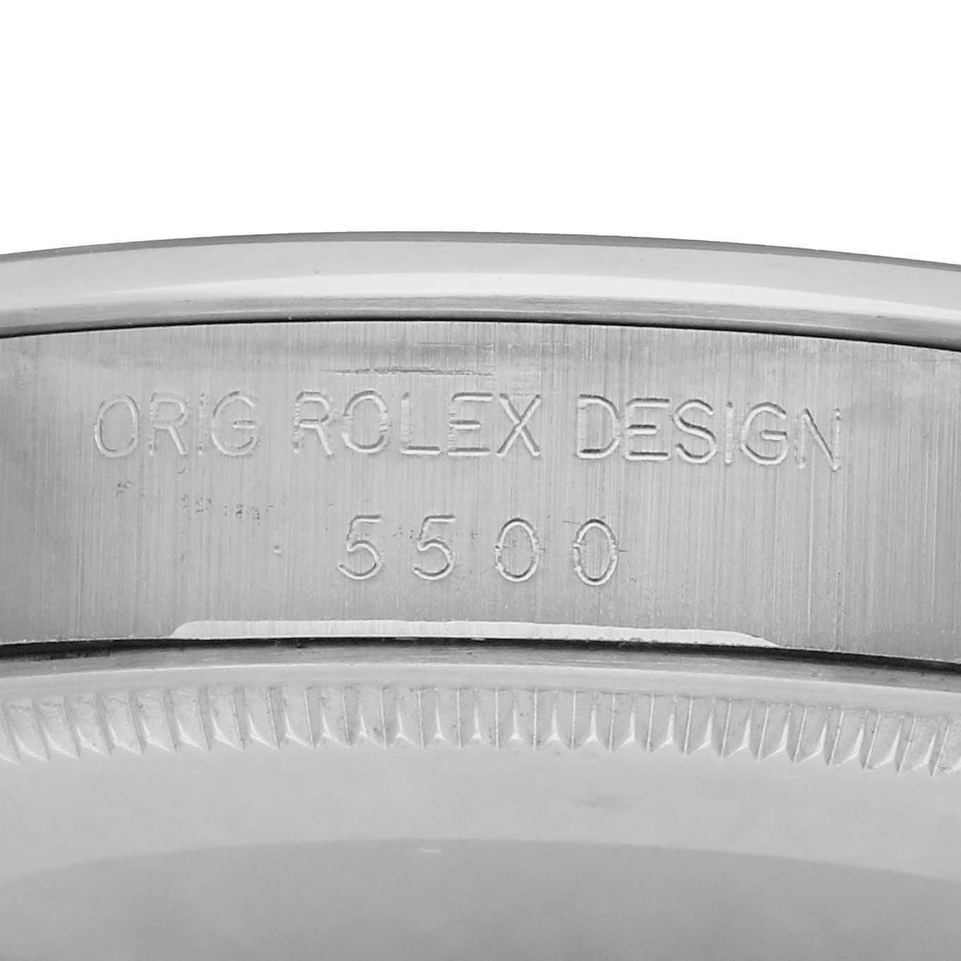 The image shows a close-up of the Rolex Air-King 5500 Men
s Stainless Steel Silver Dial model
s case, focusing on its engraved design number.