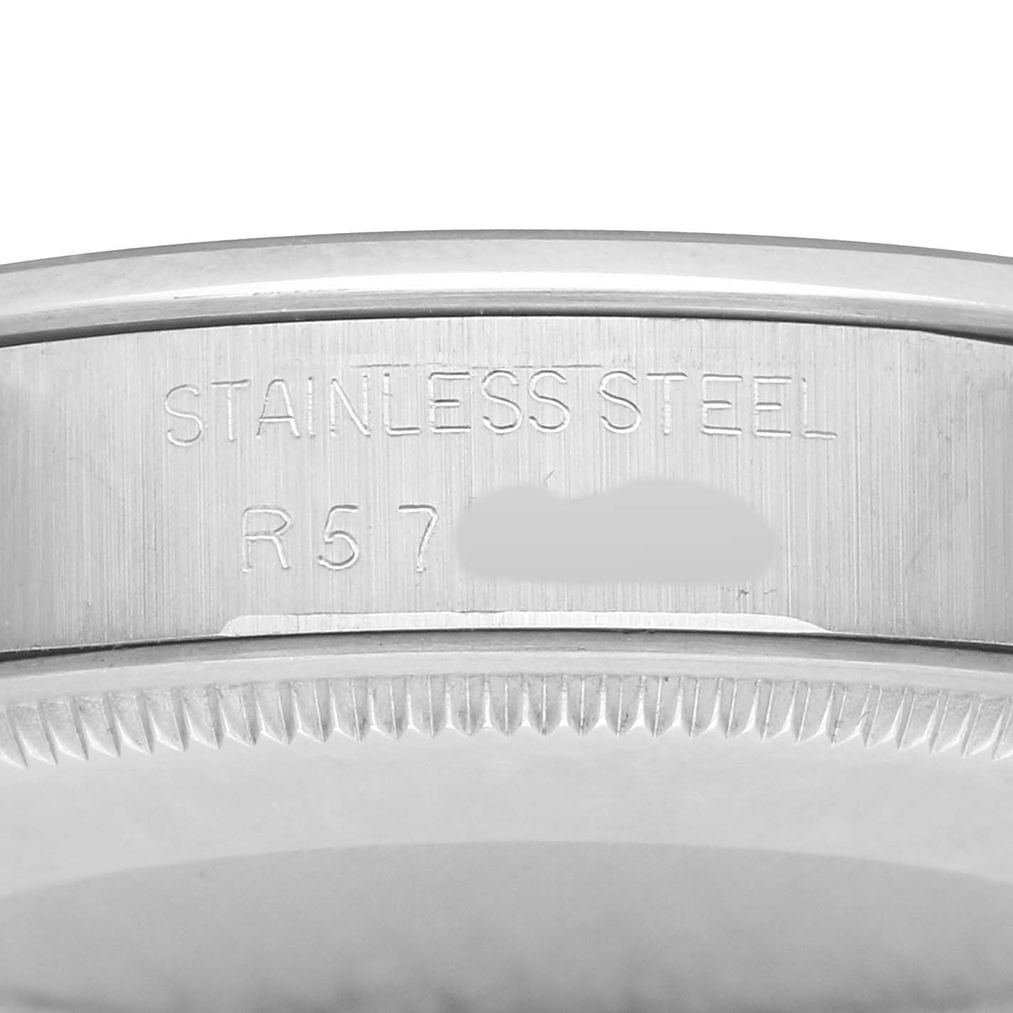 The image shows a close-up of the side of a Rolex Air-King 5500 Men
s Stainless Steel Silver Dial, highlighting the stainless steel engravings.