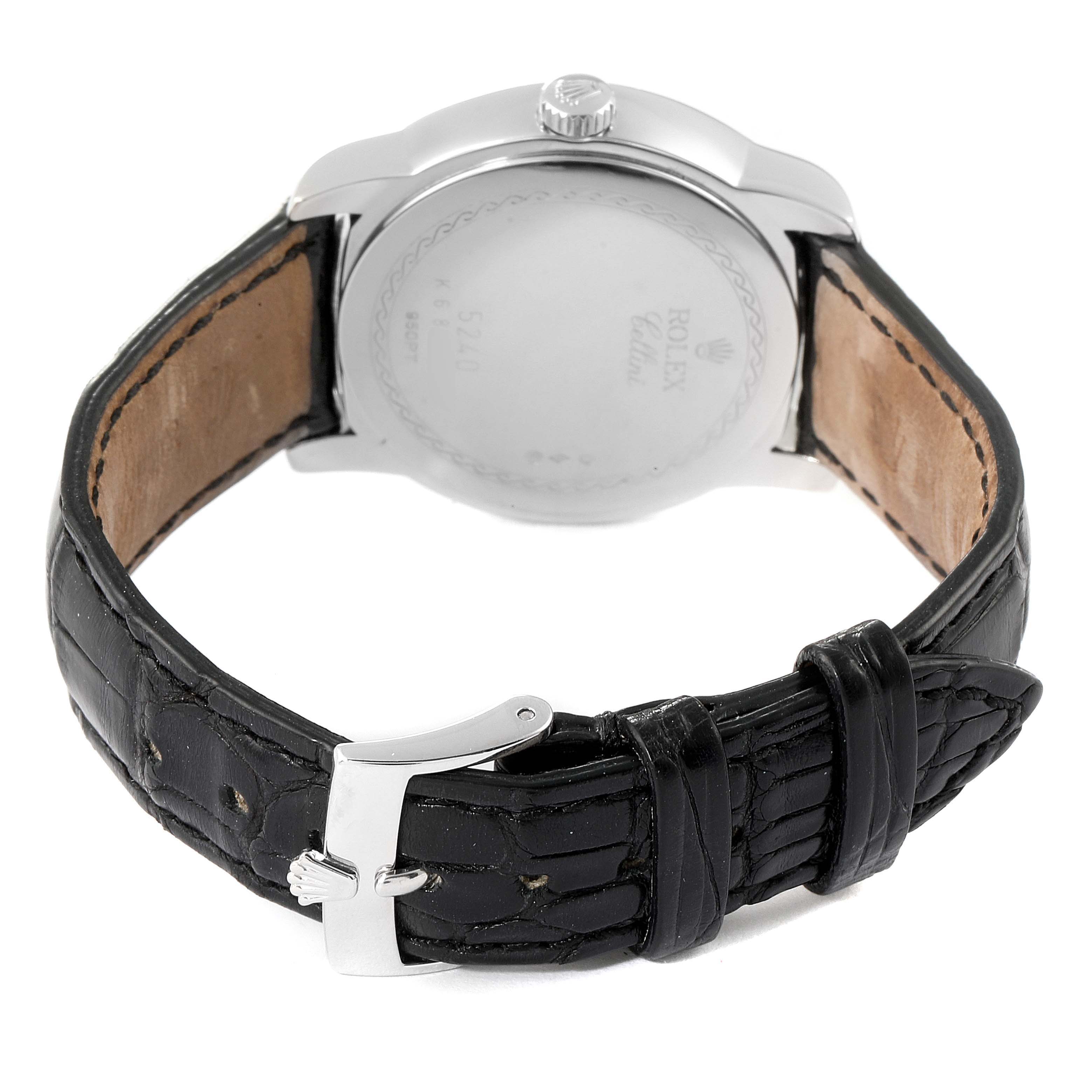 The image shows the back and strap of a Rolex Cellini 5240 Men
s Platinum Mother of Pearl Dial 5240 Men
s Platinum Mother of Pearl Dial watch, highlighting its clasp and leather band.