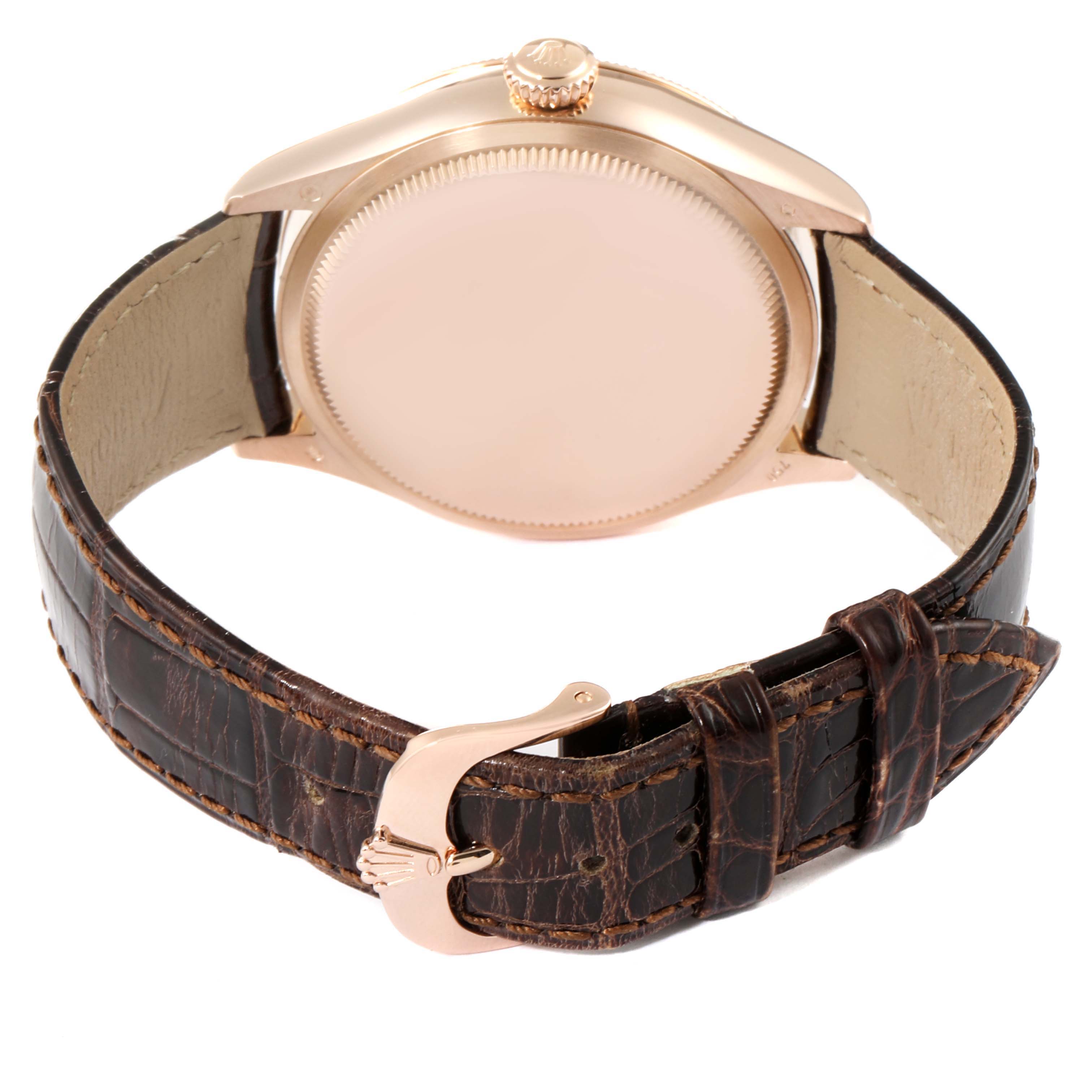 This image shows the back case and leather strap with clasp of a Rolex Cellini 50525 Men's Rose Gold Silver Dial 50525 Men's Rose Gold Silver Dial watch.