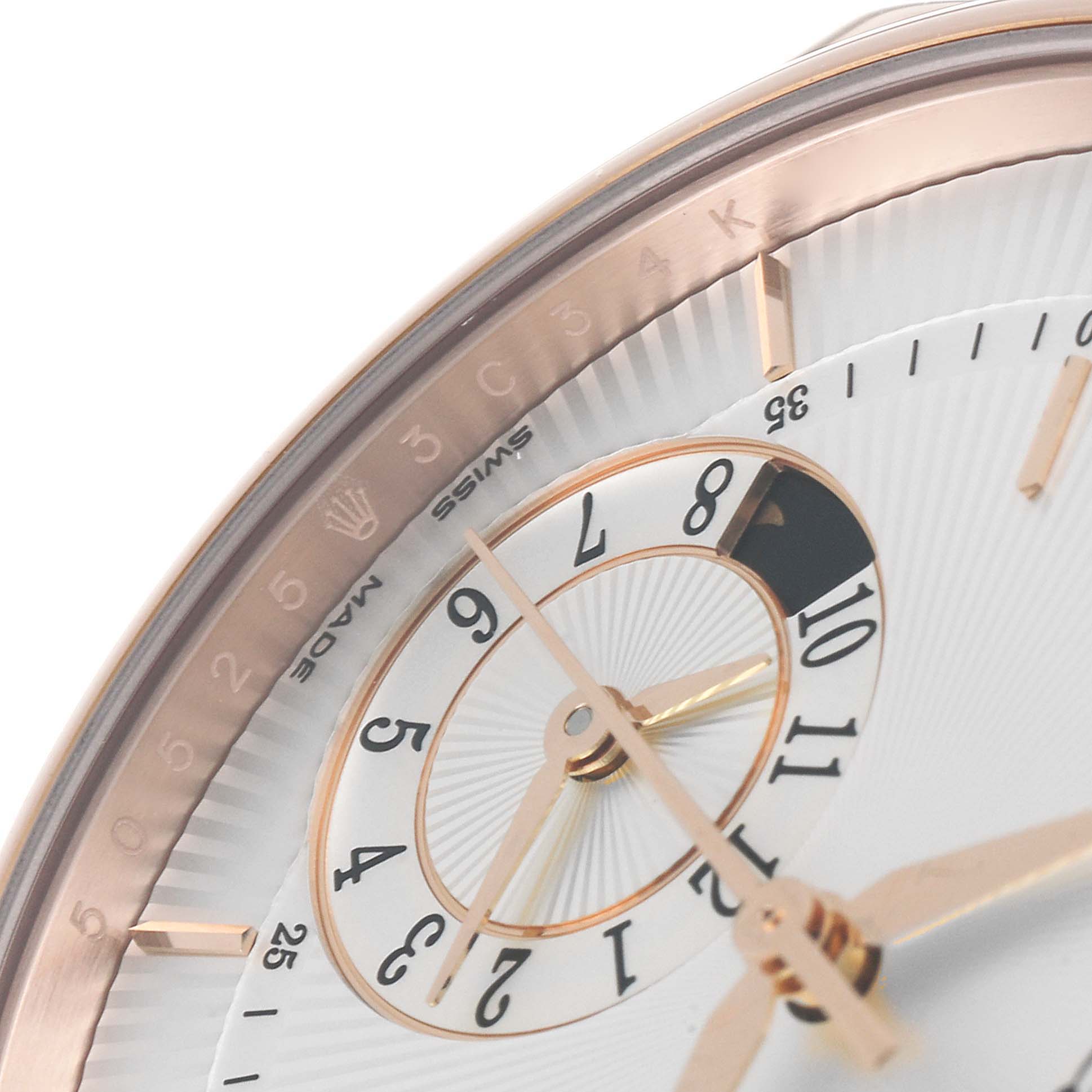 This image shows a close-up of the dial, hands, and part of the bezel of the Rolex Cellini 50525 Men's Rose Gold Silver Dial 50525 Men's Rose Gold Silver Dial watch.