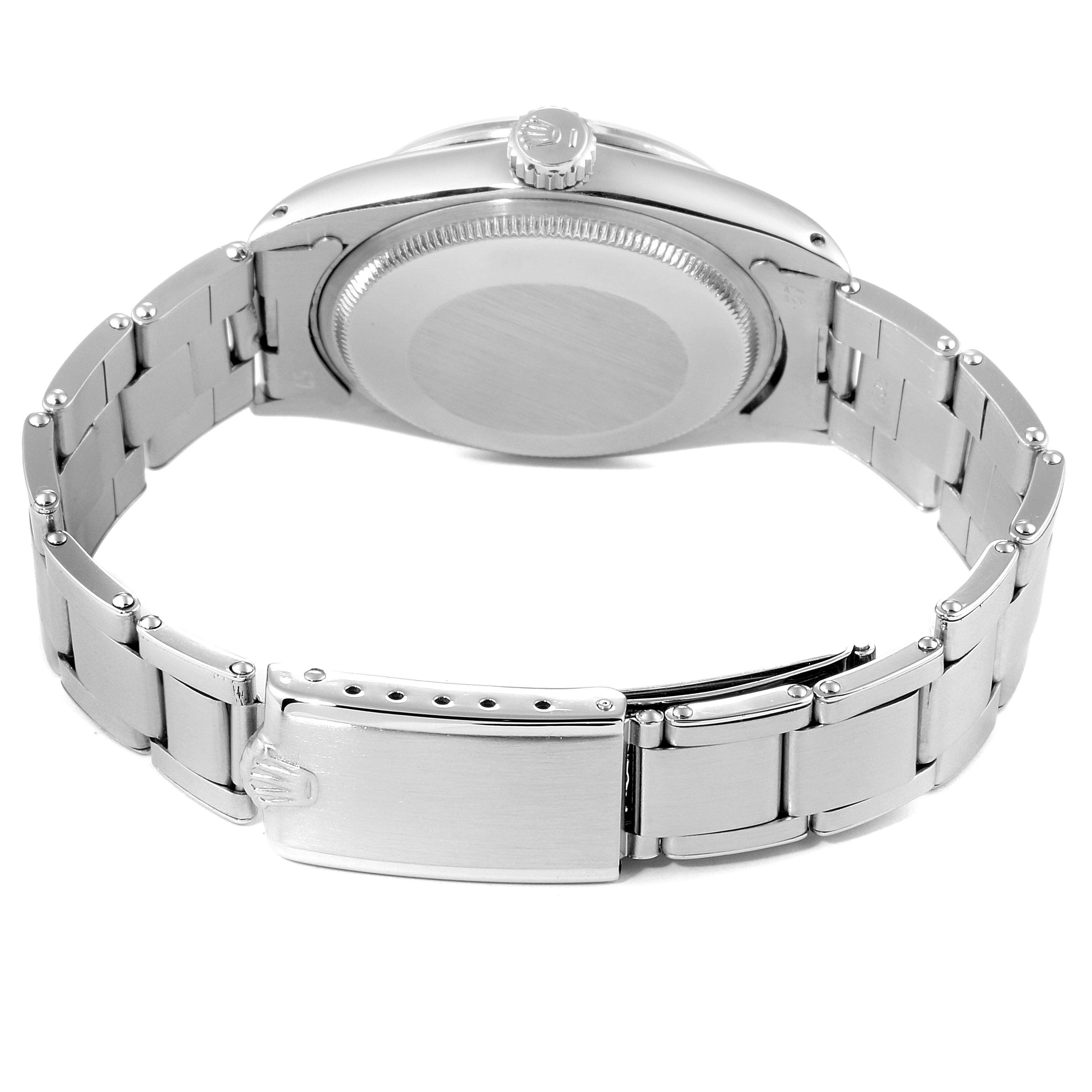 The image shows the back view of the Rolex Vintage Collection 1500 Men's Stainless Steel Silver Dial 1500 Men's Stainless Steel Silver Dial model watch, highlighting its case back, crown, and metal bracelet.