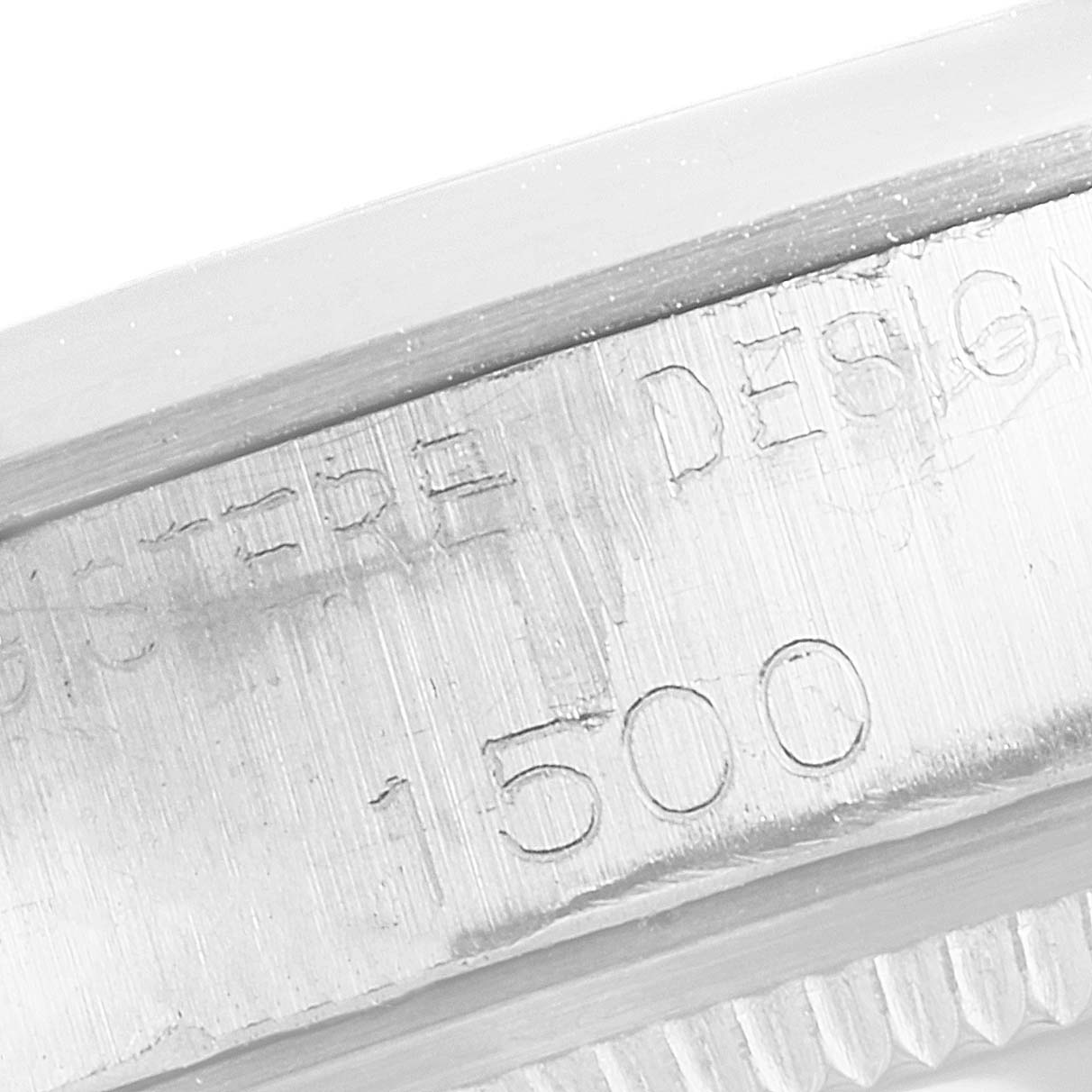 This image shows a close-up of the bezel and serial number on a Rolex Vintage Collection 1500 Men's Stainless Steel Silver Dial 1500 Men's Stainless Steel Silver Dial watch.
