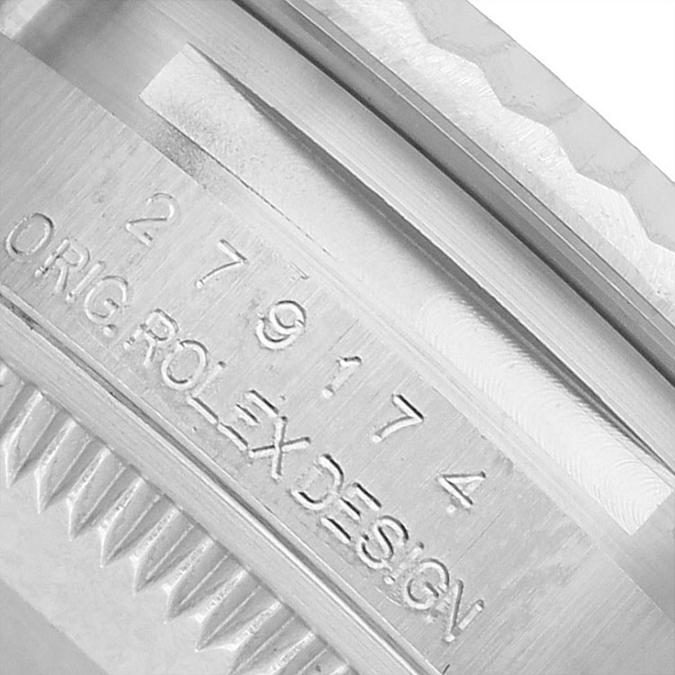 The image shows a close-up of the case edge and engraving on a Rolex Datejust 279174 Women's Stainless Steel Pink Dial.