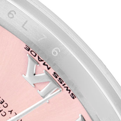 The image shows a close-up of the bezel and partial dial of a Rolex Datejust 279174 Women's Stainless Steel Pink Dial, highlighting the edge with Roman numerals and part of the “SWISS MADE” marking.