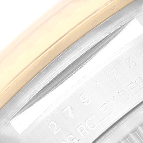 Close-up of the Rolex Datejust 279173 Women's Stainless Steel Purple Dial 279173 Women's Stainless Steel Purple Dial model showing the edge of the bezel and part of the engraved serial number.